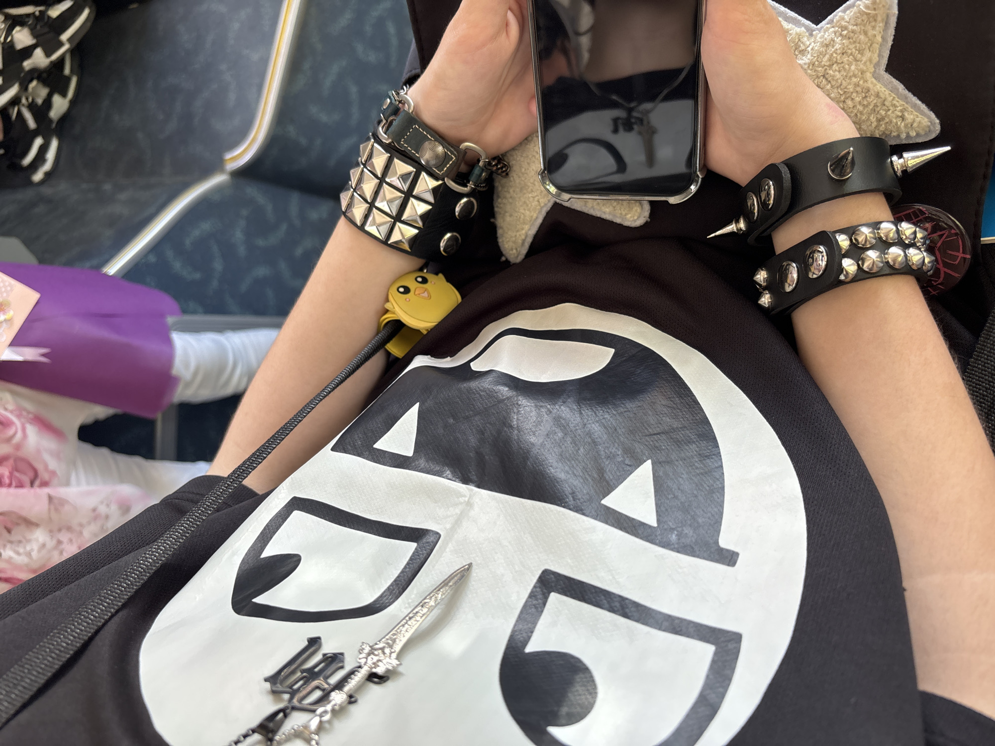 Graphic tee and wrist accessories, close up in Varna