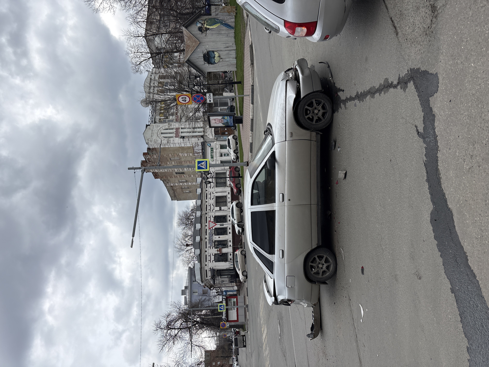 Morning documentation captures Ulyanovsk streetscapes, buildings, minor accident