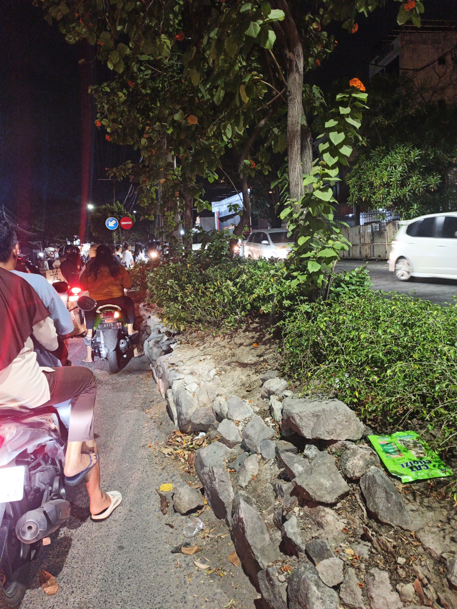 Night scenes from Surabaya streets, gas stations, and gatherings