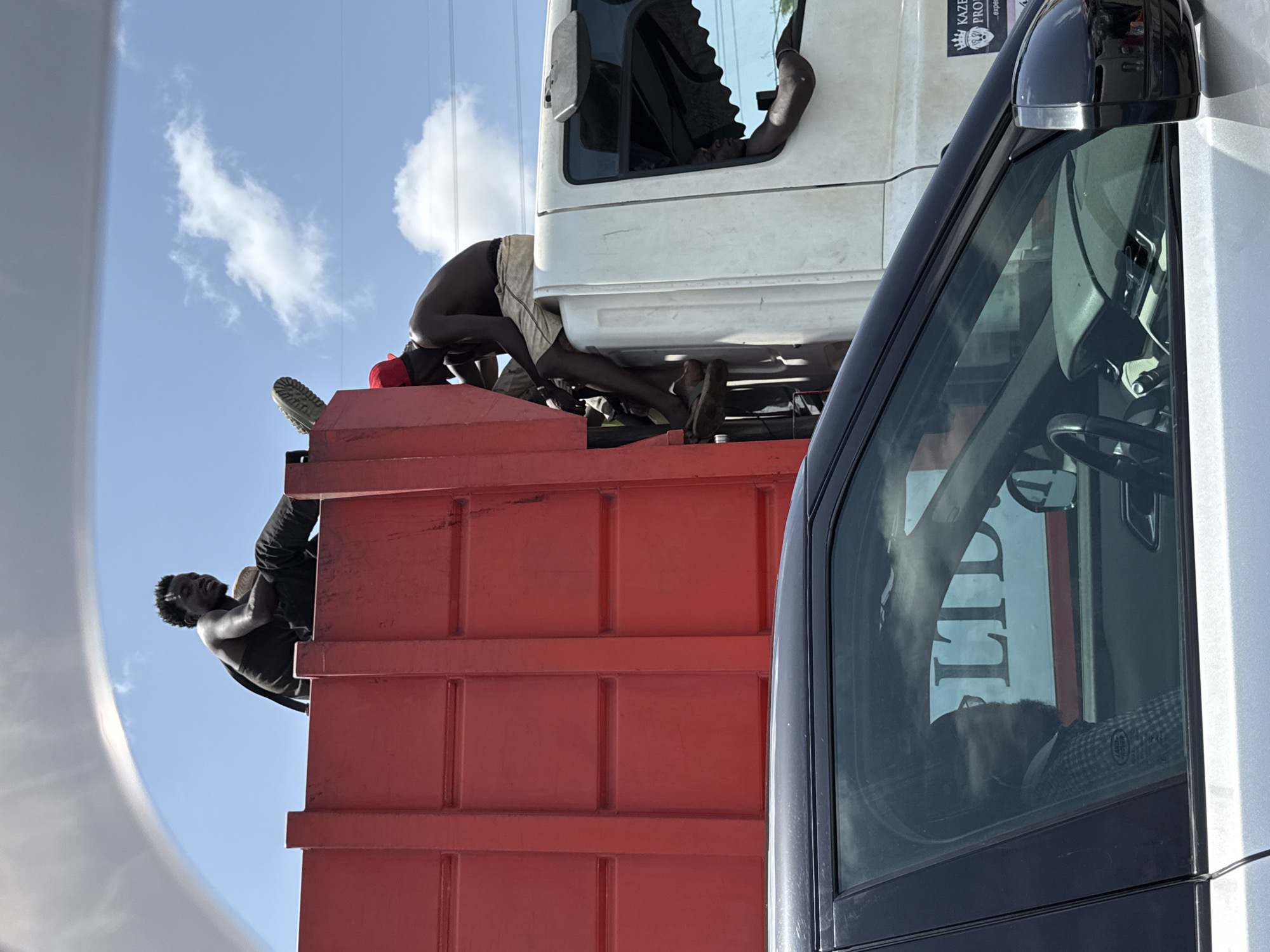 People hitch rides on truck in Lekki, Nigeria