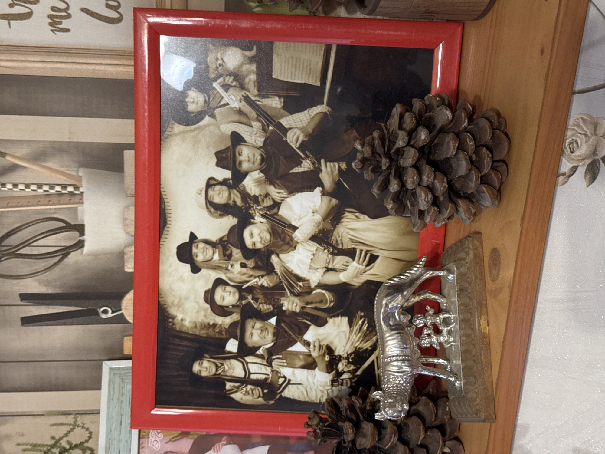 Eclectic decorative shelf in Almaty, clocks, figurines, and curiosities