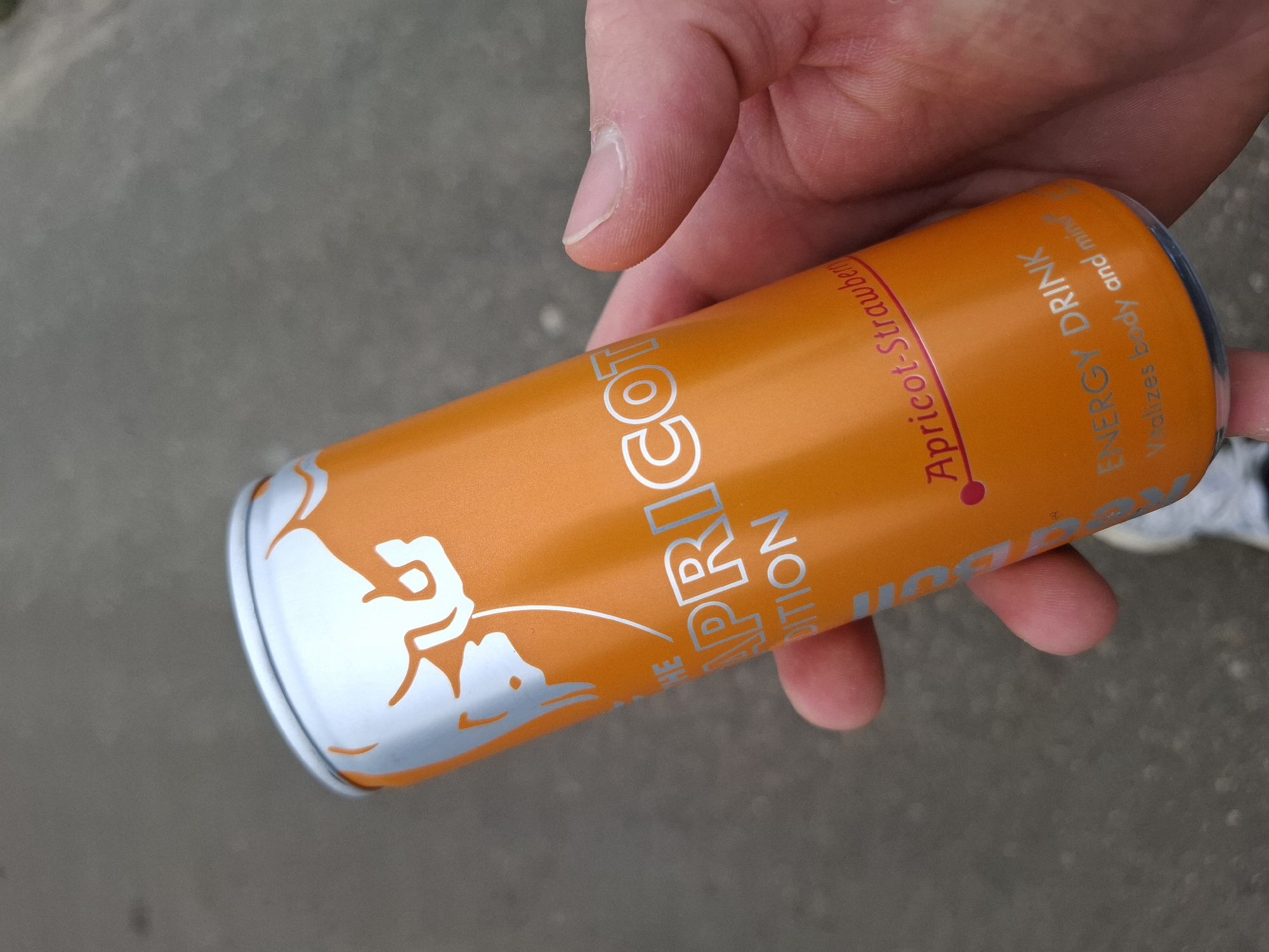 Person holds Red Bull energy drink in Samokov