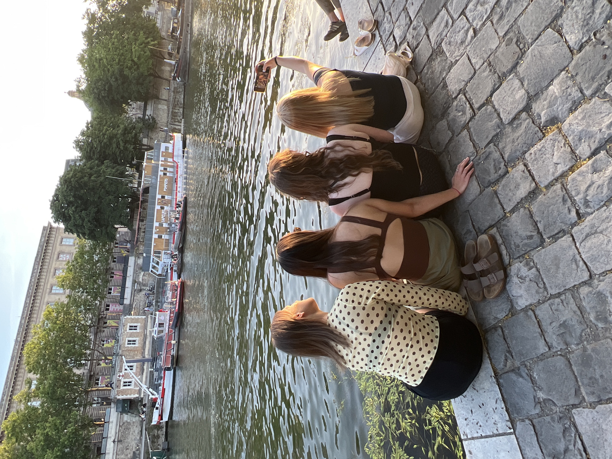 Parisians gather along Seine River embankments for sunset socializing