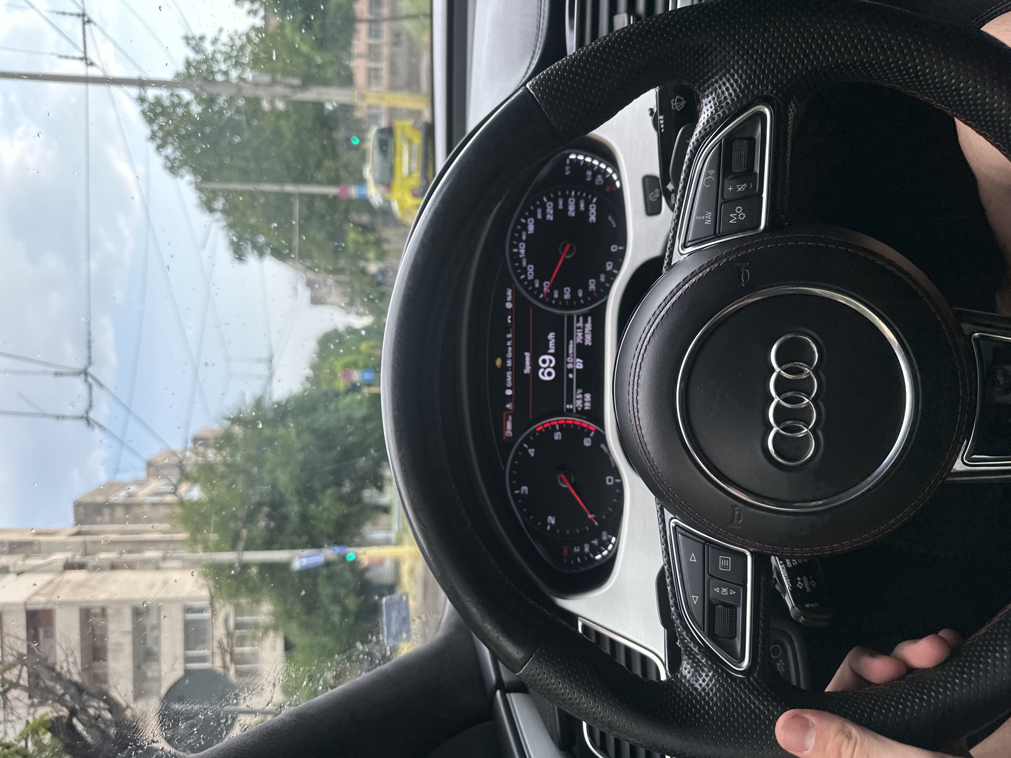 Driving through rainy Ruse in an Audi, July afternoon