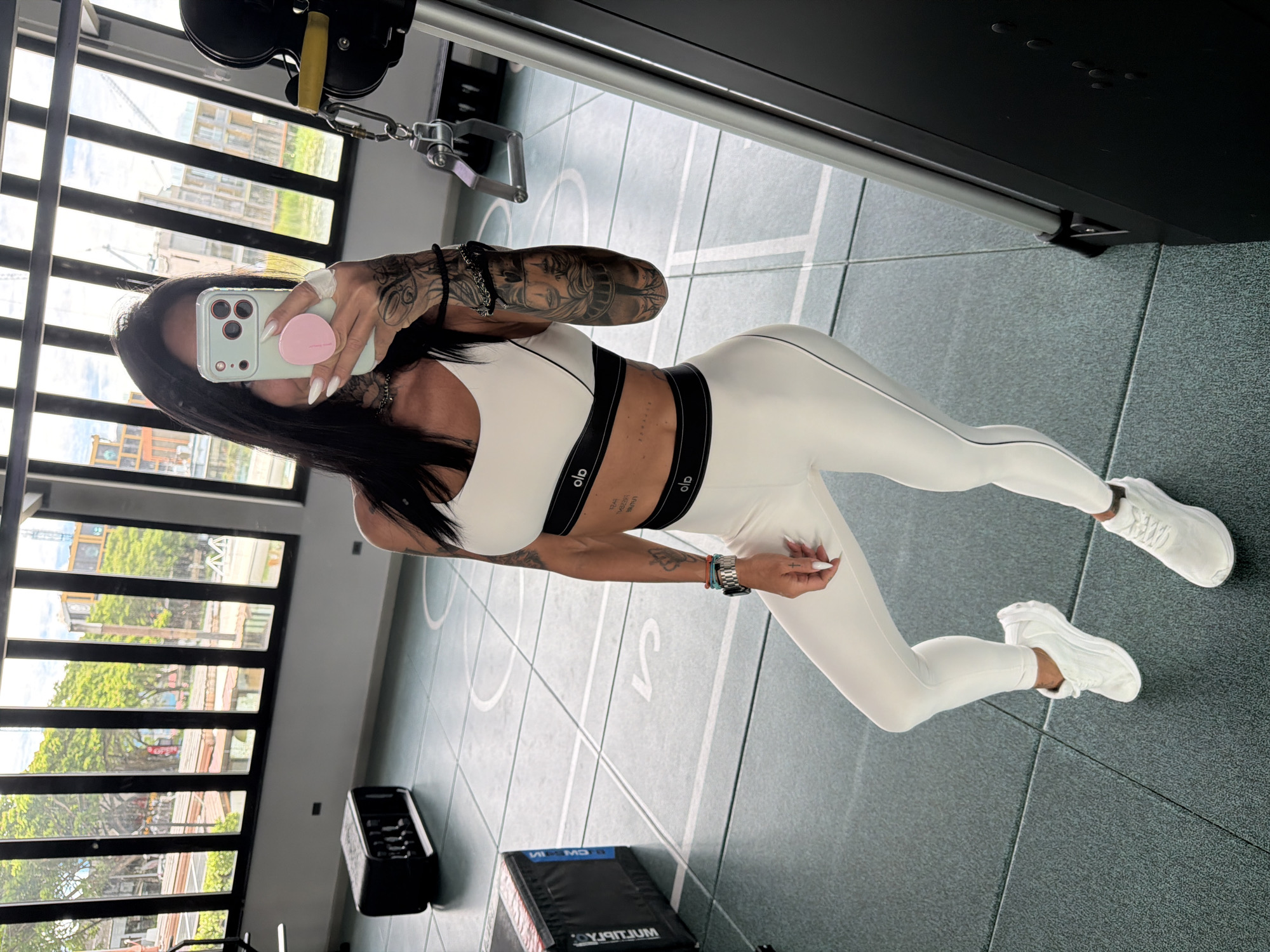 Gym mirror selfie in Choeng Thale showing workout attire and tattoos