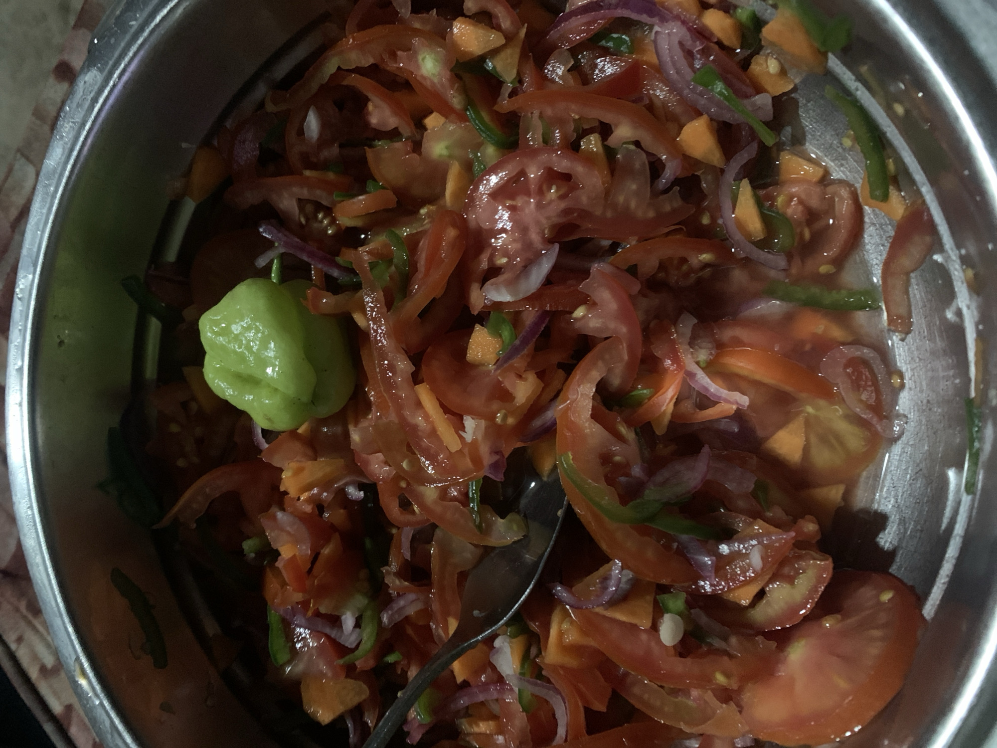 Fresh vegetable salad with Scotch bonnet pepper prepared in Dar es Salaam