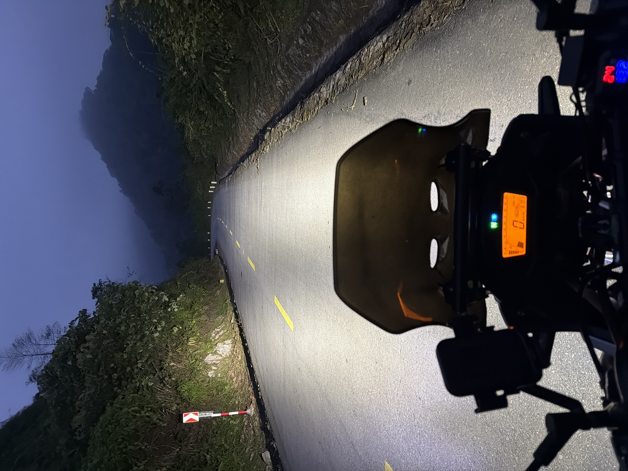 Motorcyclist captured on foggy hillside road near Đà Nẵng