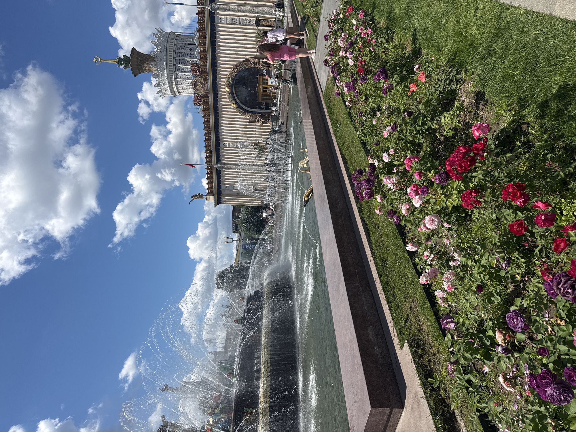 Summer morning at VDNKh: fountains, flowers, craft market, and reenactors