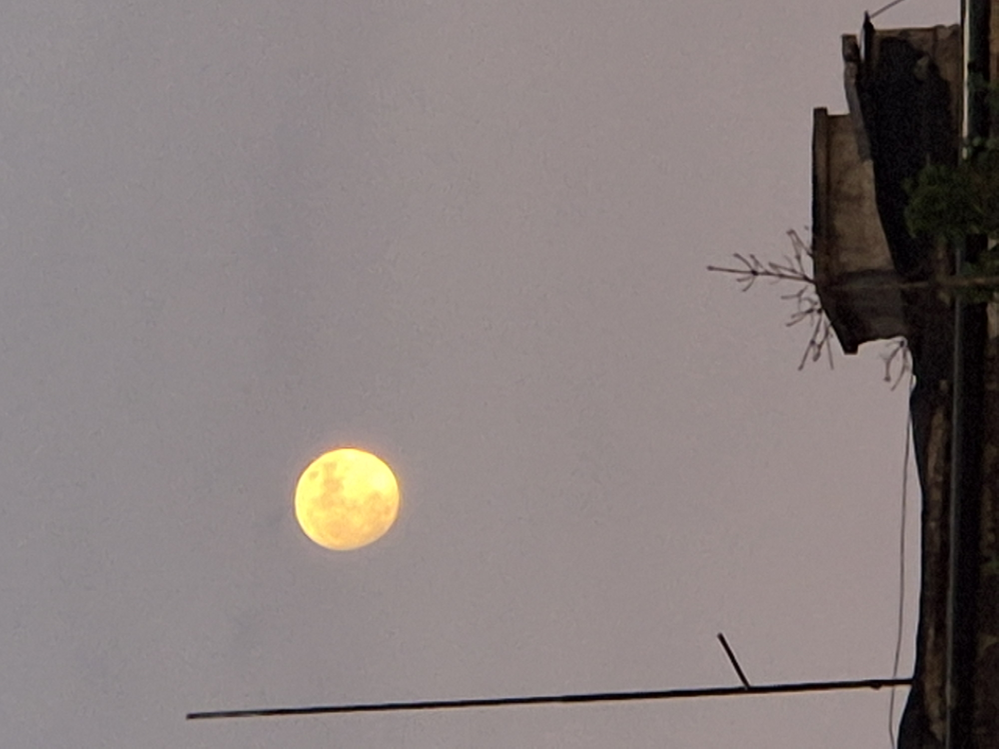 Full moon rising over Sofia rooftops, June 2026