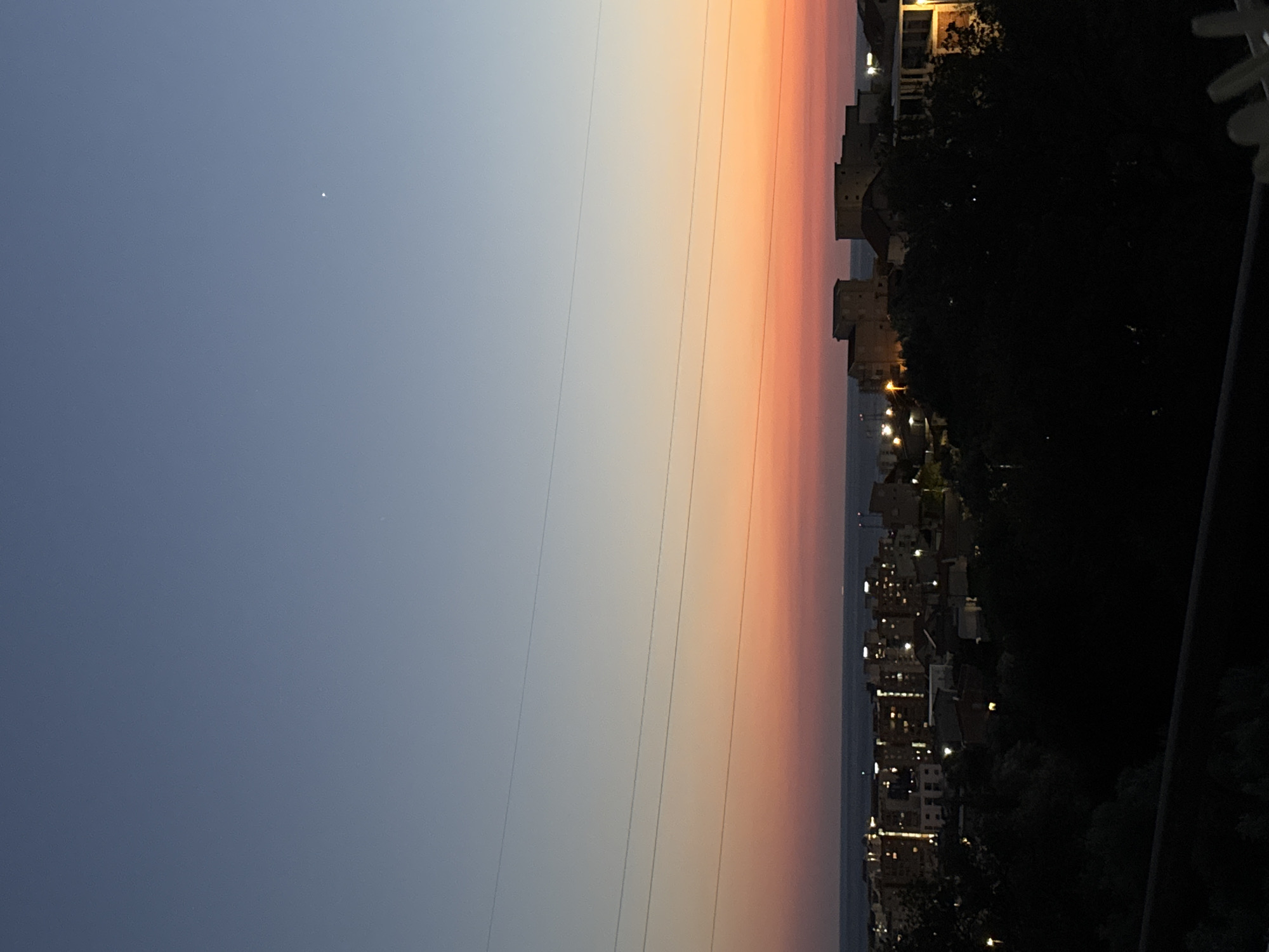 Sunset hour in Sustaš: dusk skies, contrails, and a tortoise