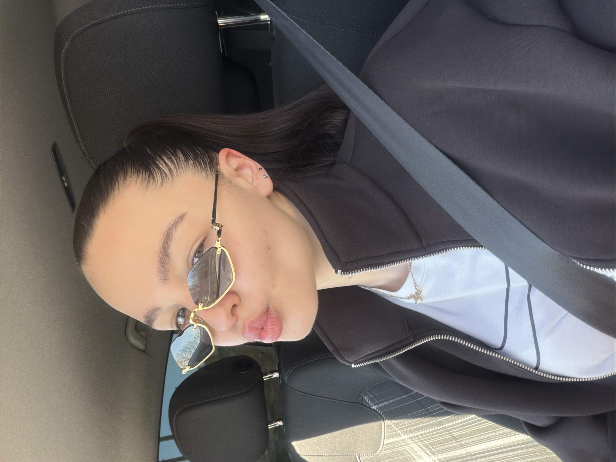 Woman in sunglasses photographed in car near Pernik, Bulgaria