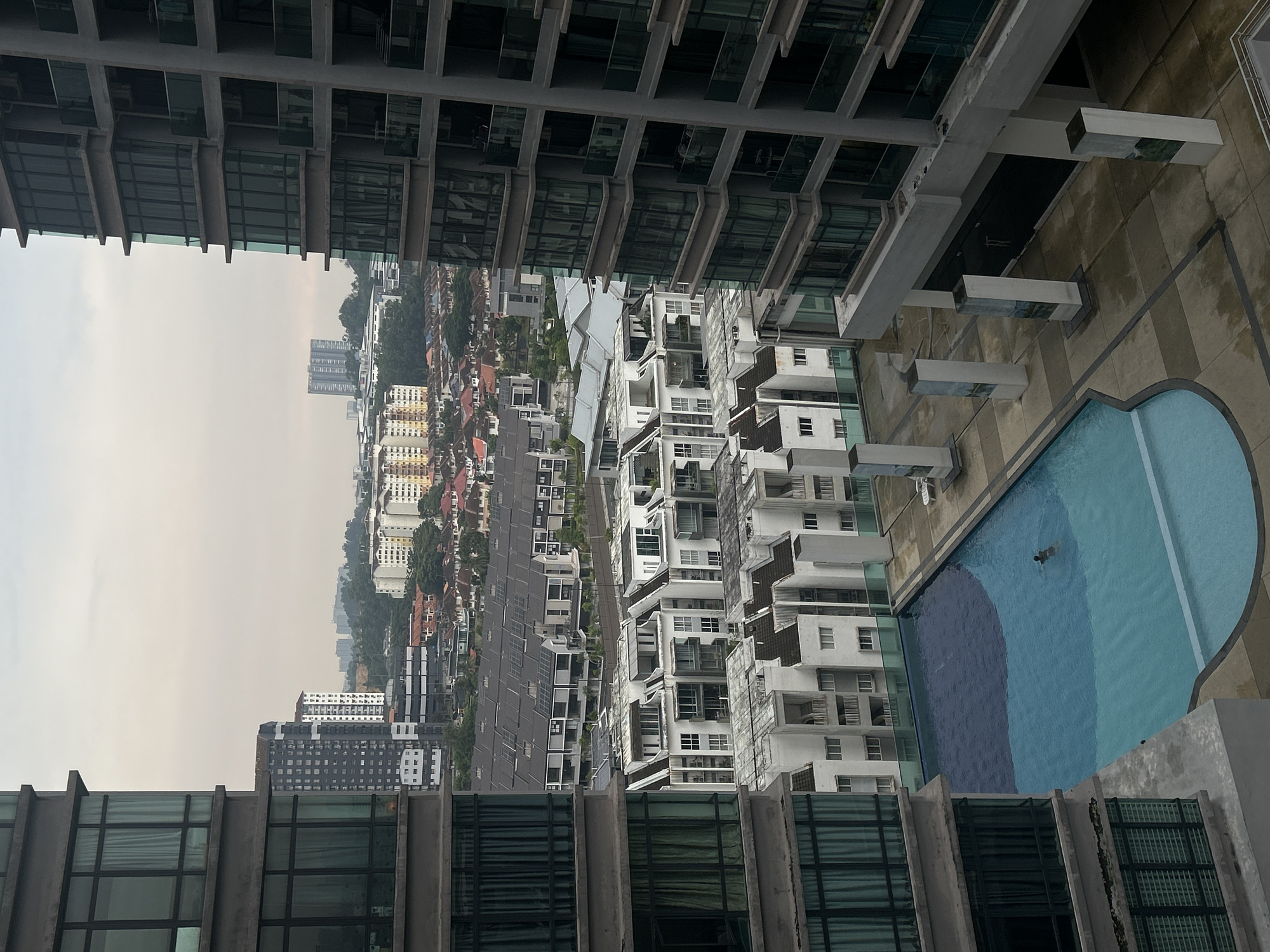 High-rise observer documents overcast morning scenes across Kuala Lumpur