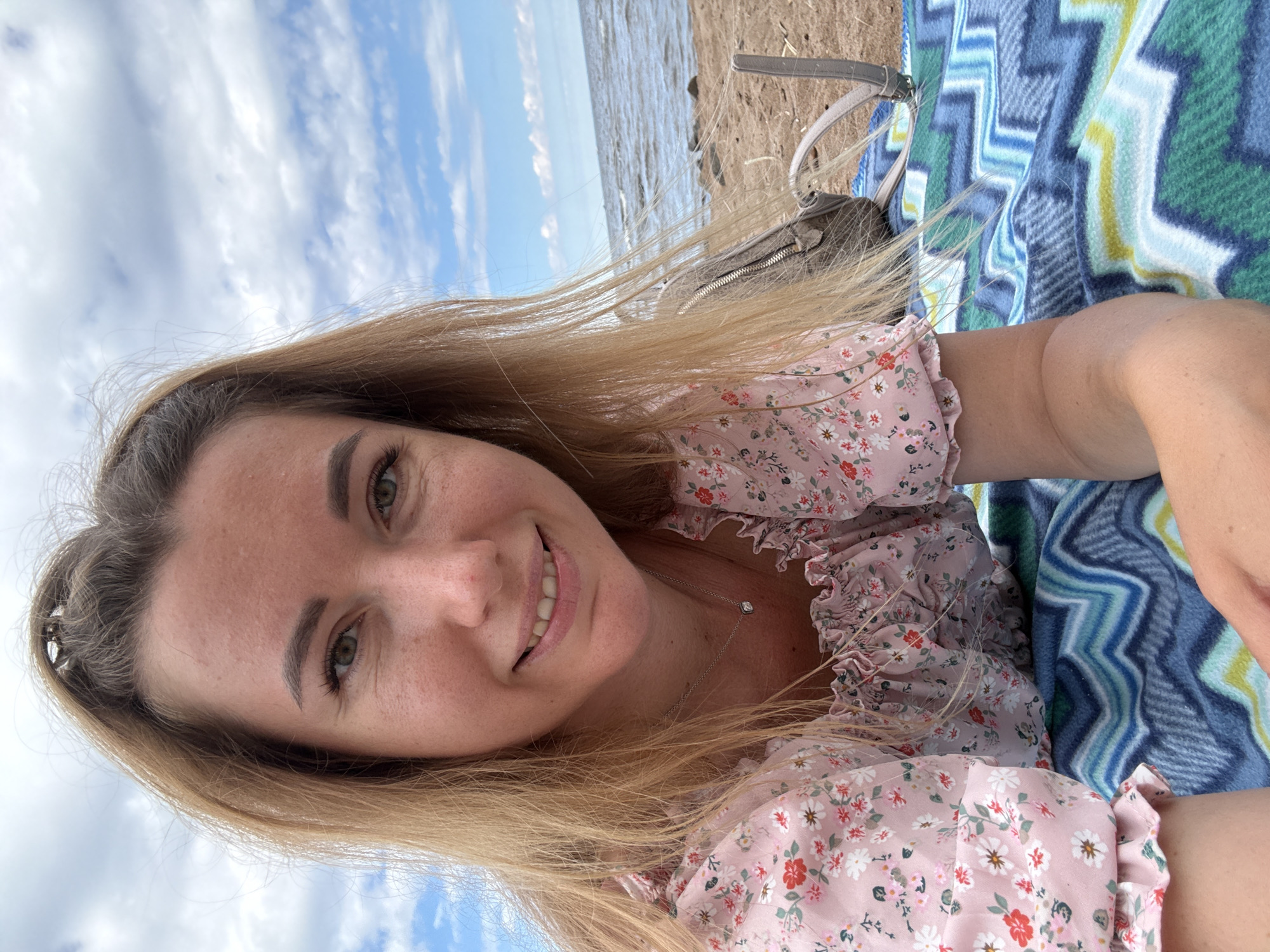 Relaxed beach morning with coffee, blanket, and selfies