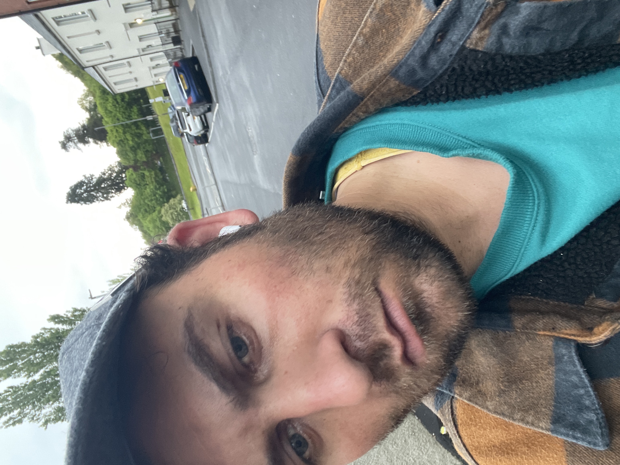 Man in plaid jacket photographed on Armagh street