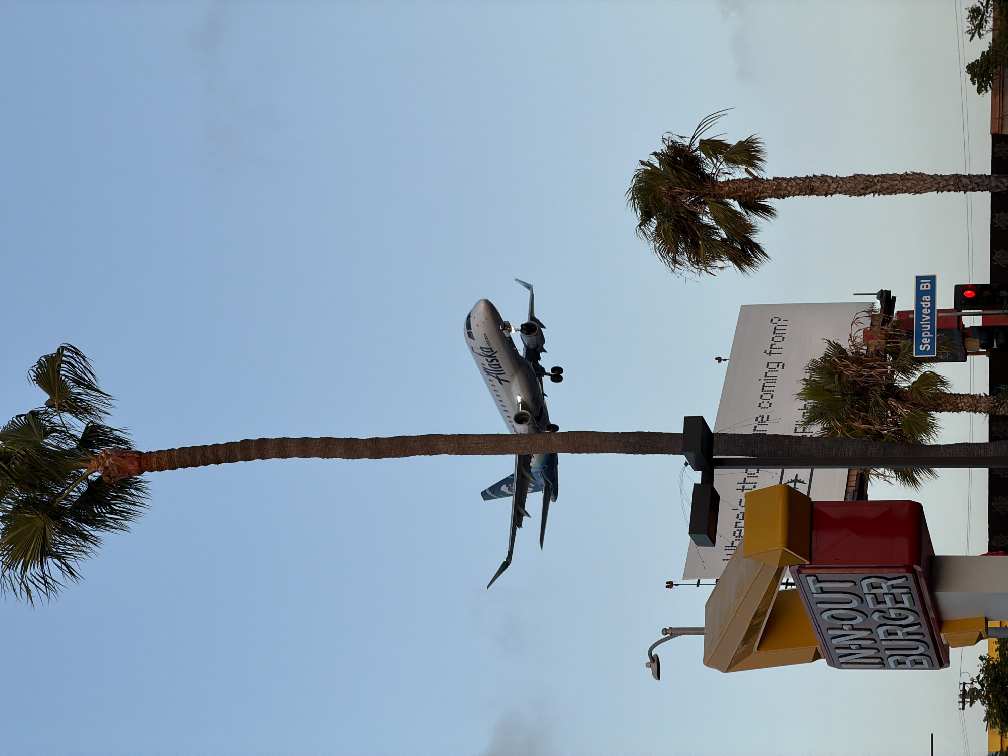 Late-night street life under the LAX flight path
