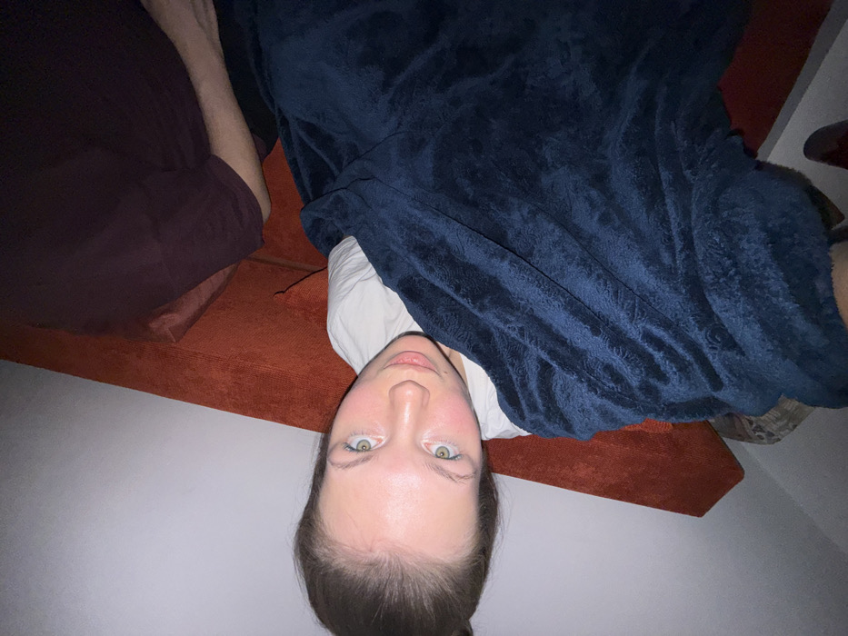 Evening relaxation captured on orange couch in Belgrade suburb