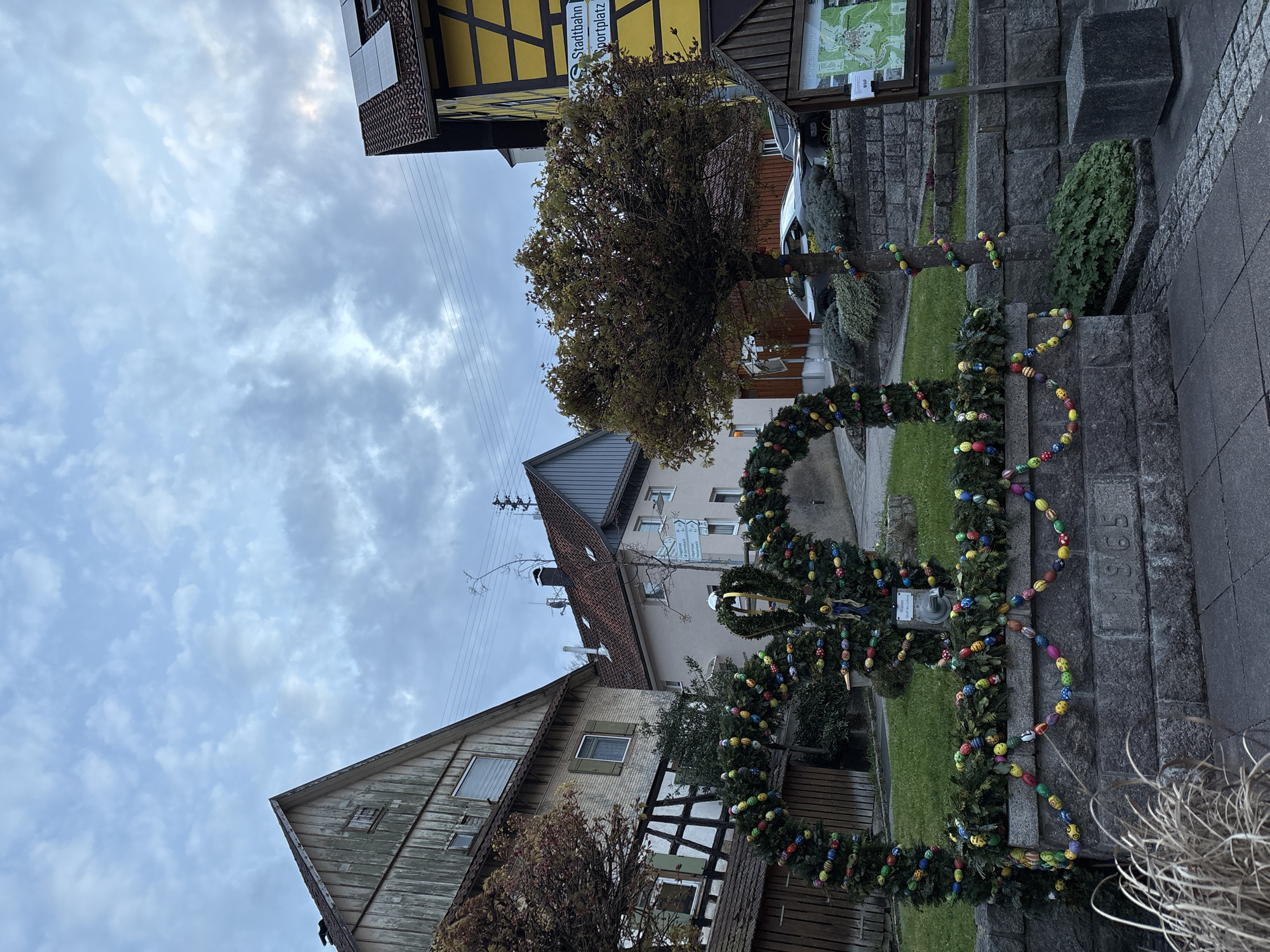Easter decorations adorn stone structure in Forbach, Germany