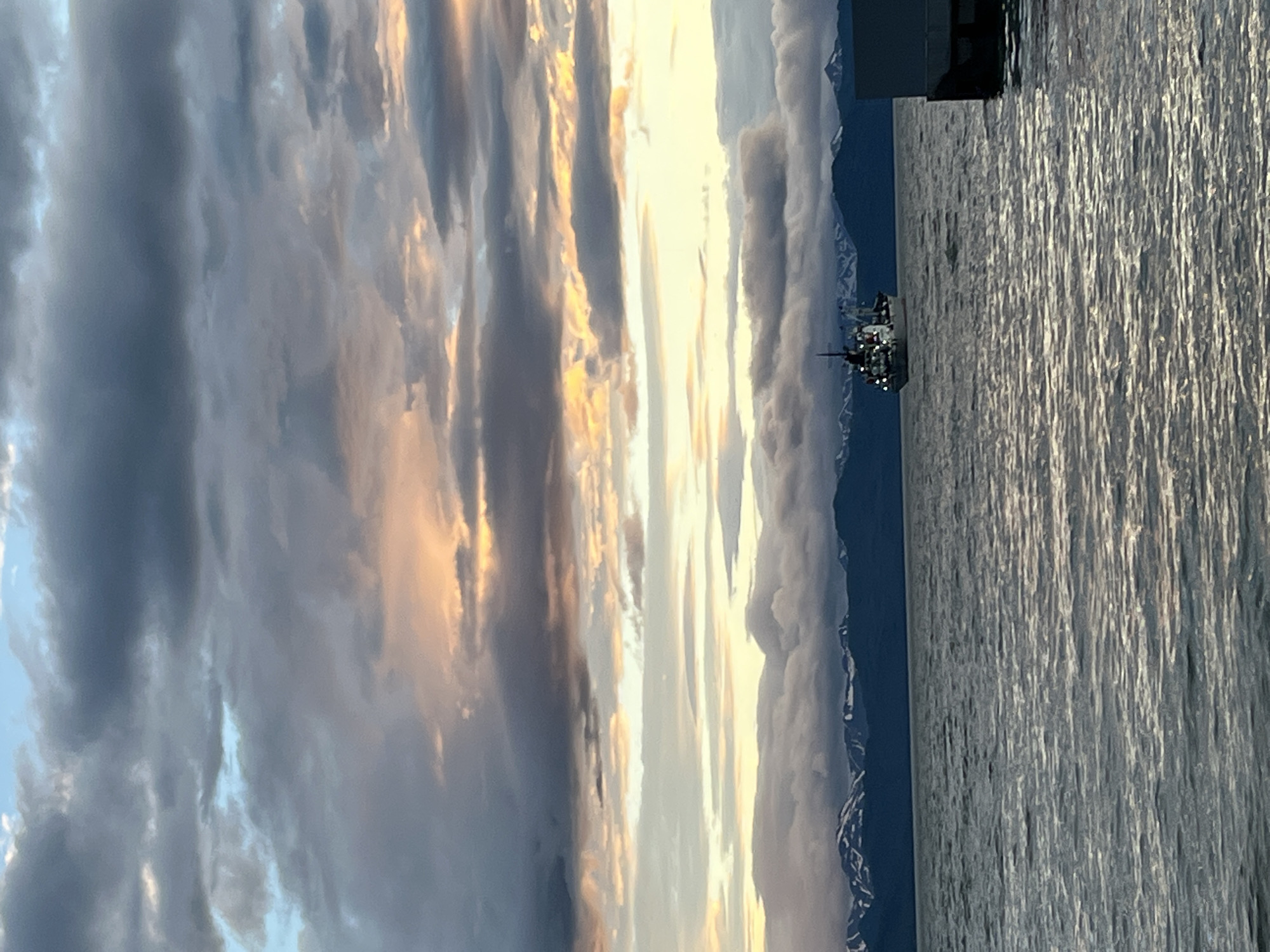 Sunset over Kamchatka bay with mountains and shoreline views