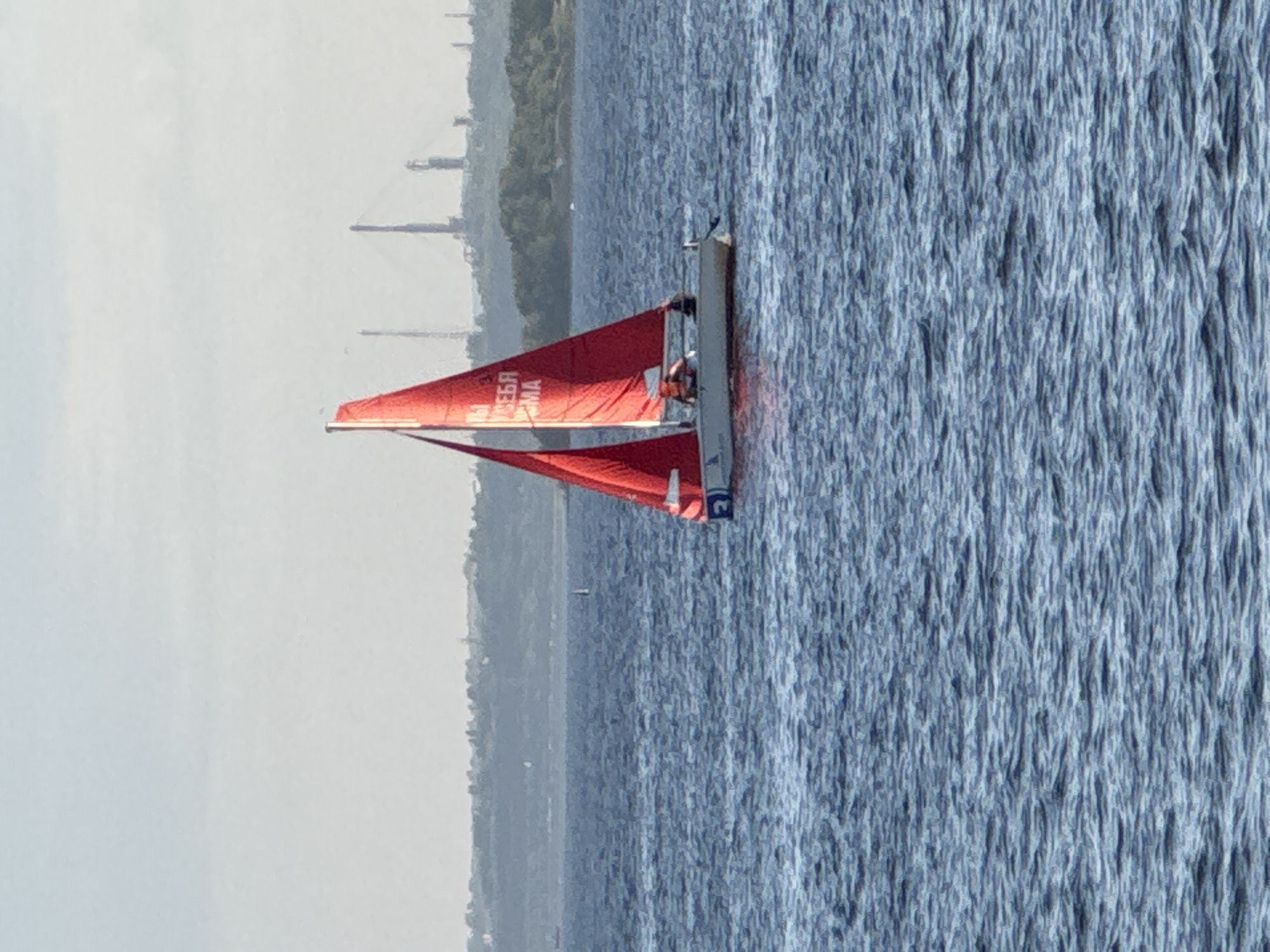 Sailing and street life along Saratov's Volga River embankment