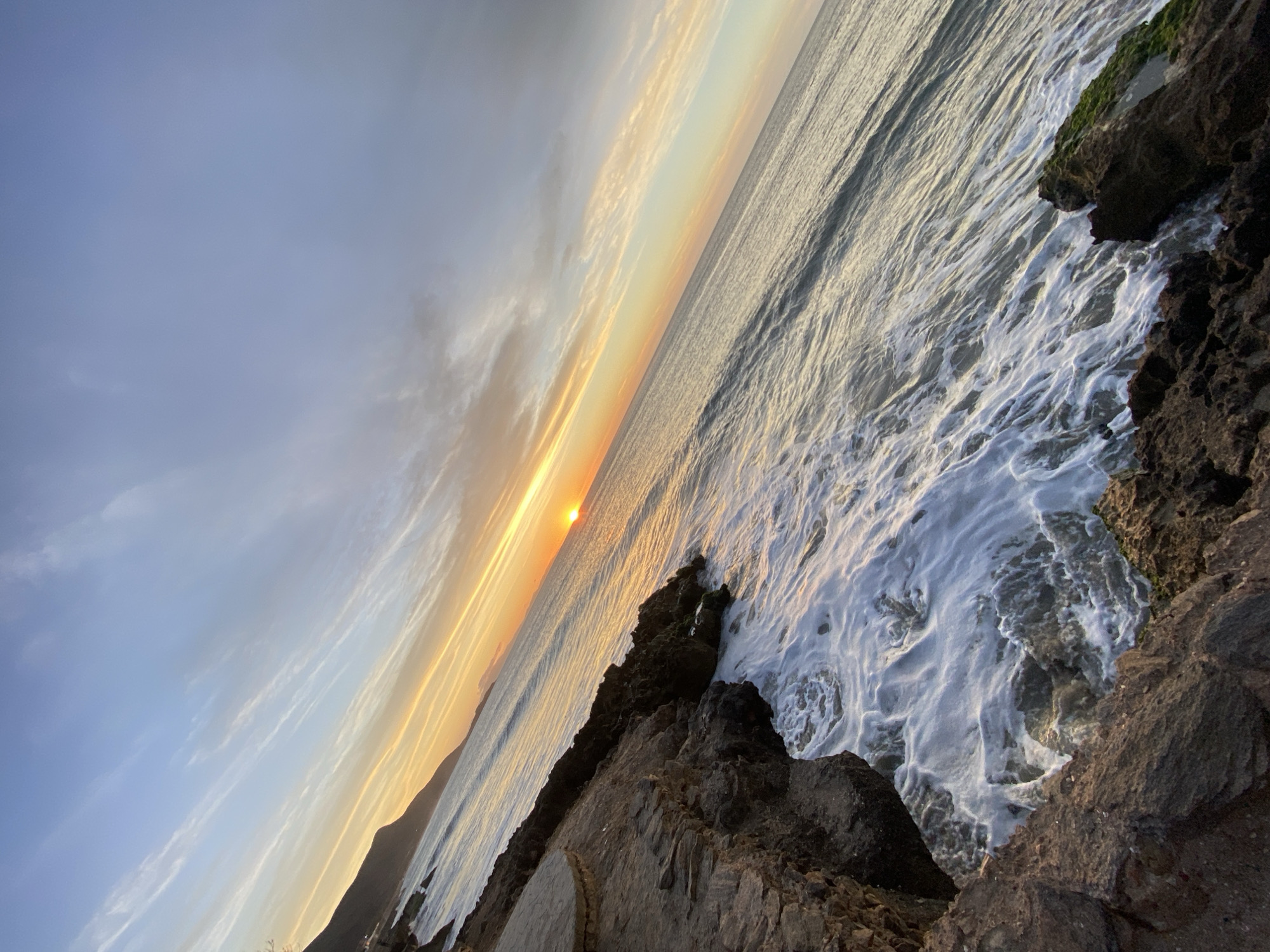 Sunset watchers gather at Juan Griego coastline