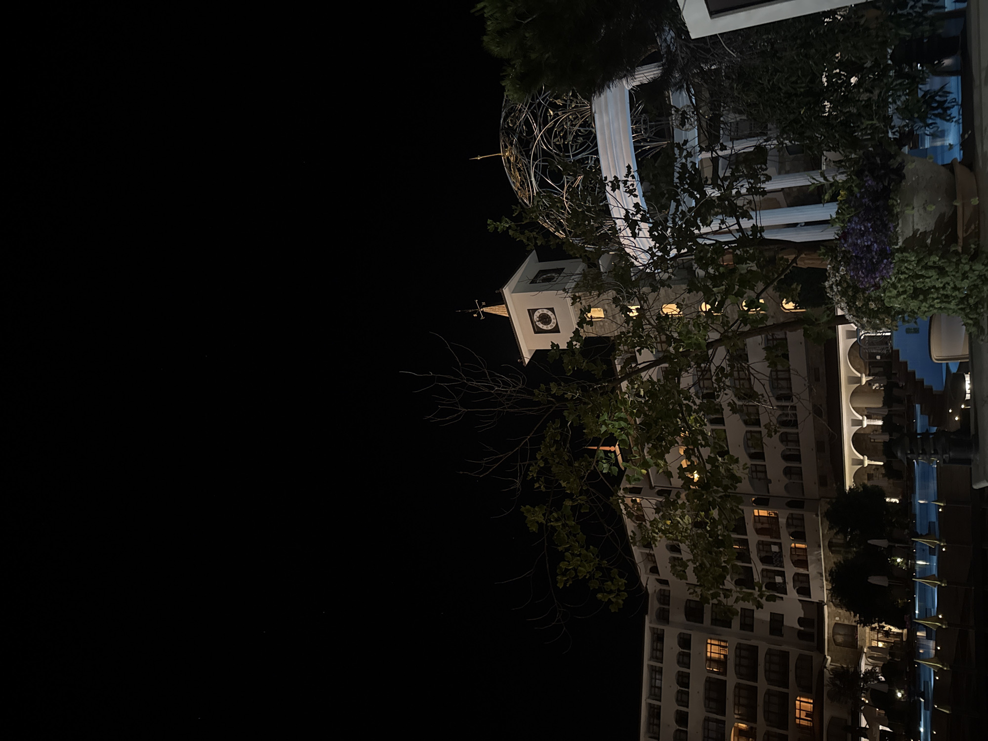 Nighttime scenes around a lit-up beach resort strip