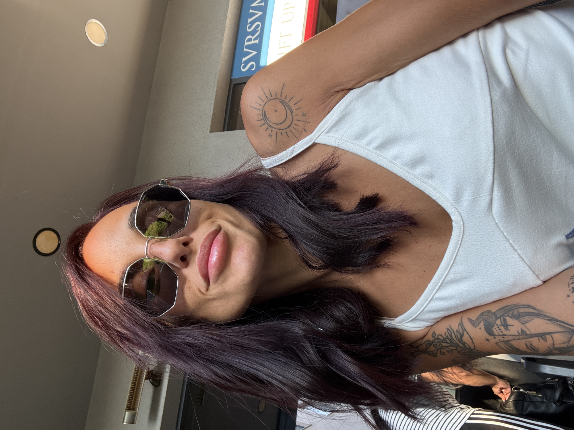 Tattooed and sunglassed in Pleven under a clear sky