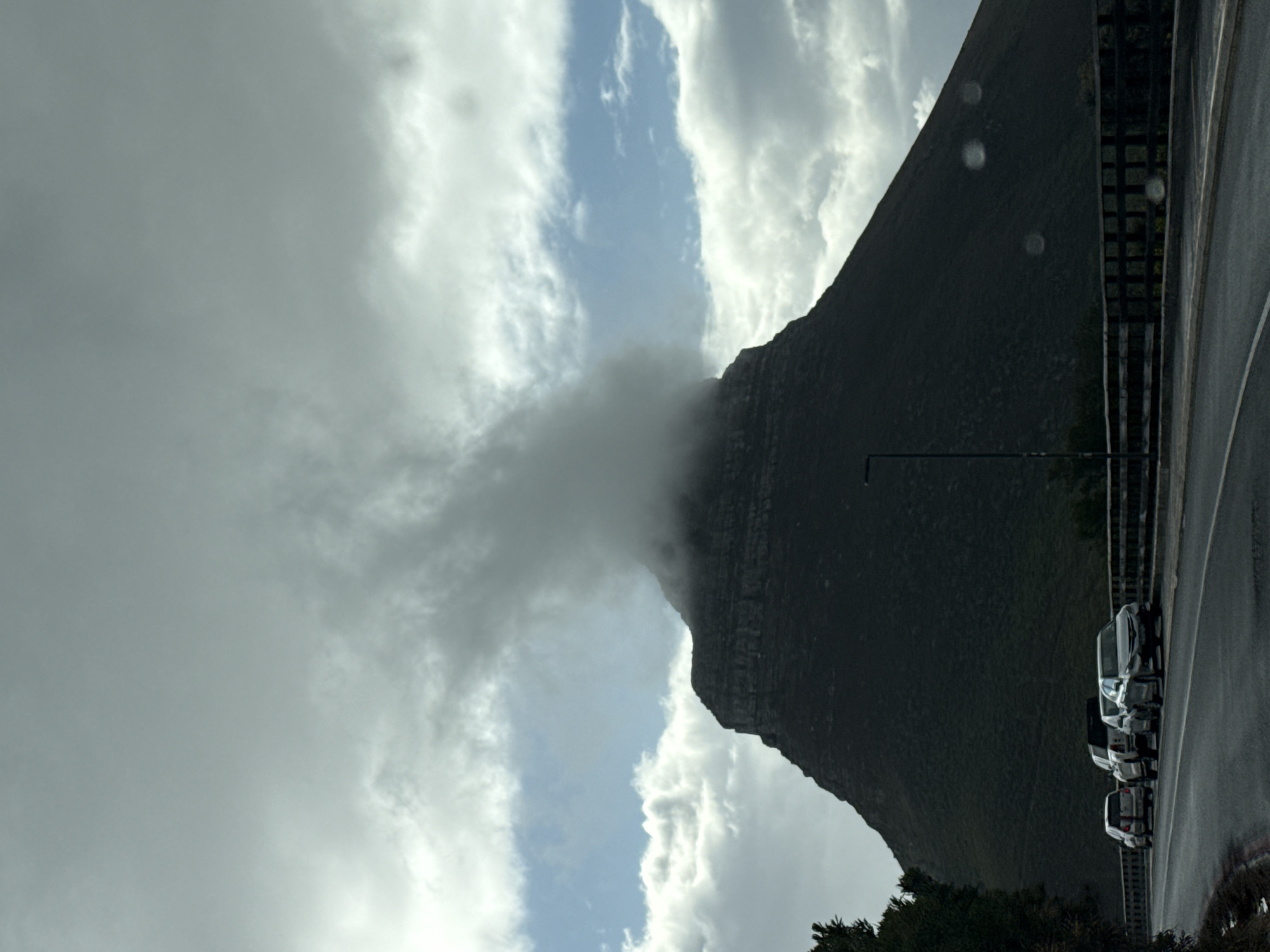 Cape Town mountains shrouded in clouds during overcast afternoon
