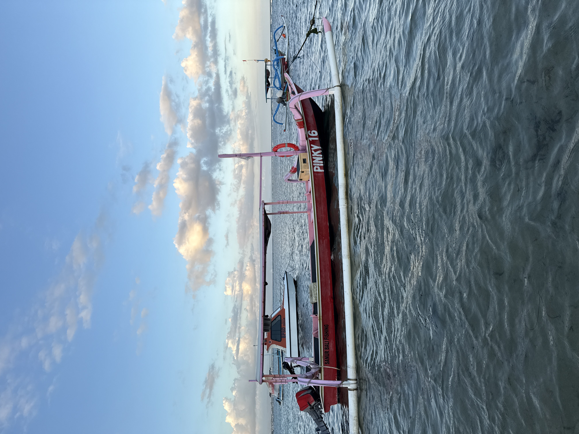 Traditional outrigger boats spotted in calm Denpasar waters