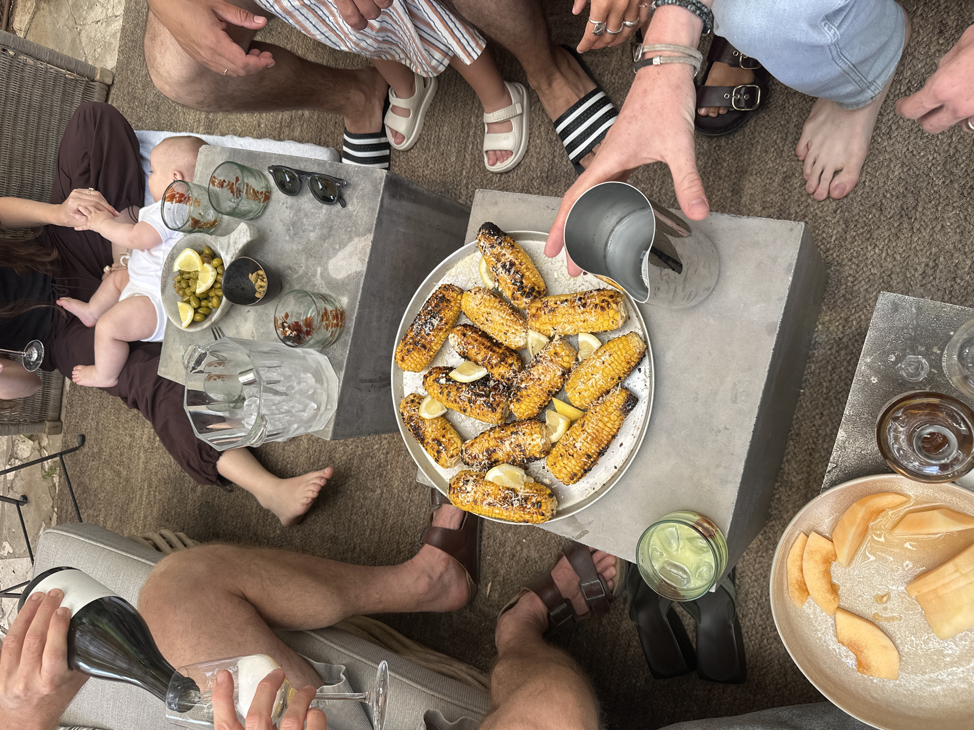 Casual garden gathering captured in Tel-Aviv outdoor dining scene