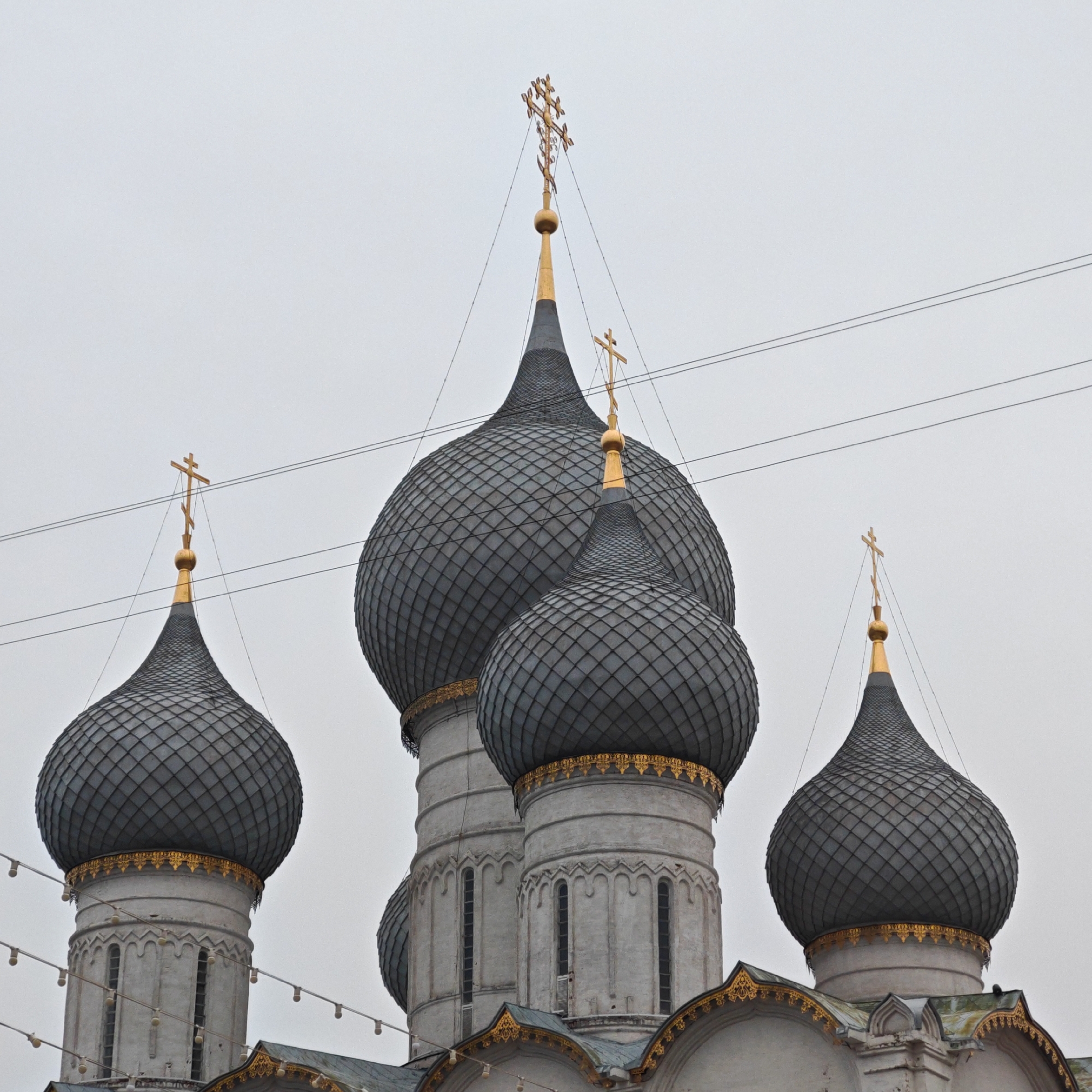 Cyclist documents Rostov Kremlin's medieval architecture during afternoon visit