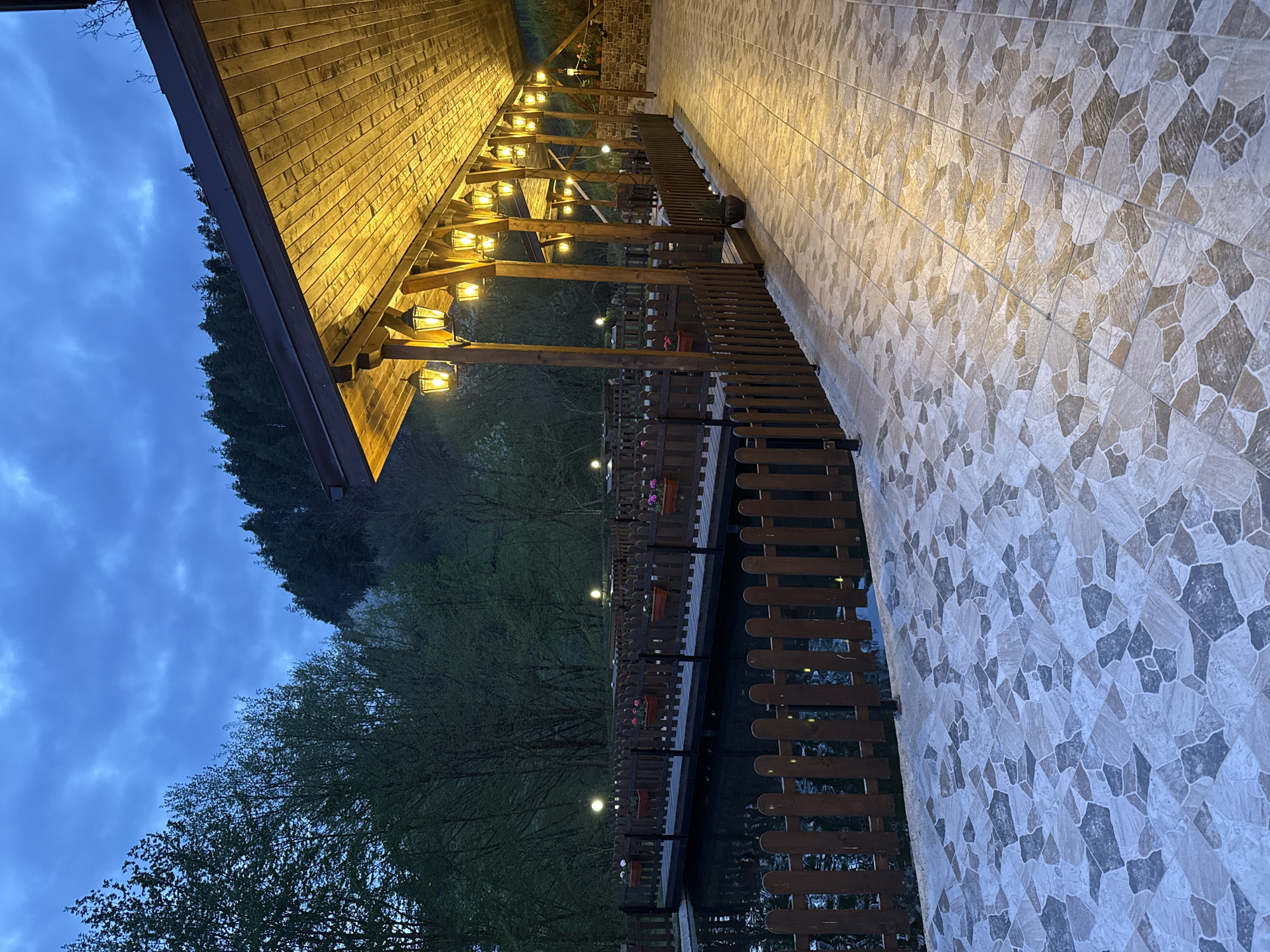 Evening dining venue captured in twilight outdoor and indoor scenes