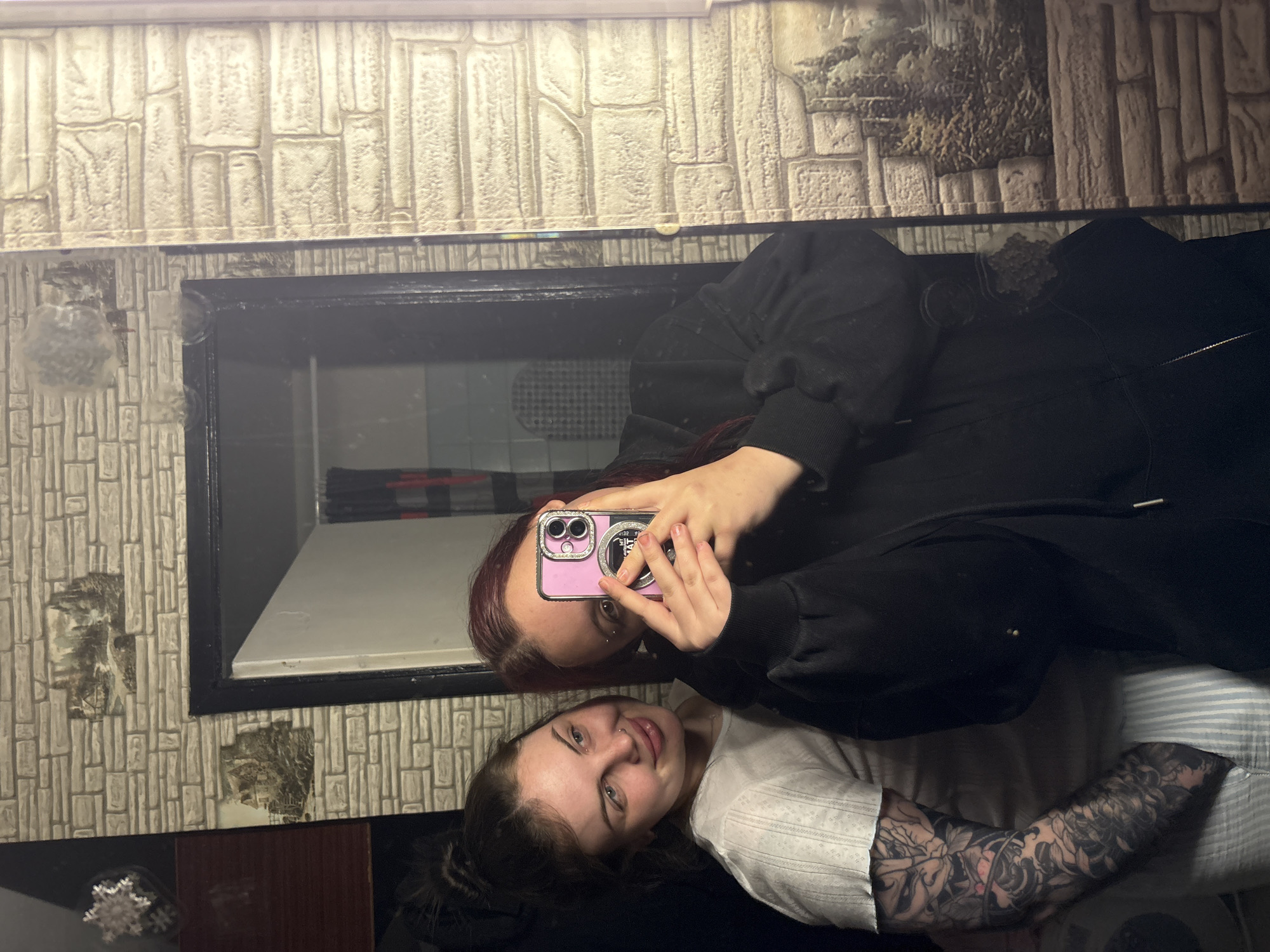 Two women take mirror selfie in Chornomorskoe, Ukraine