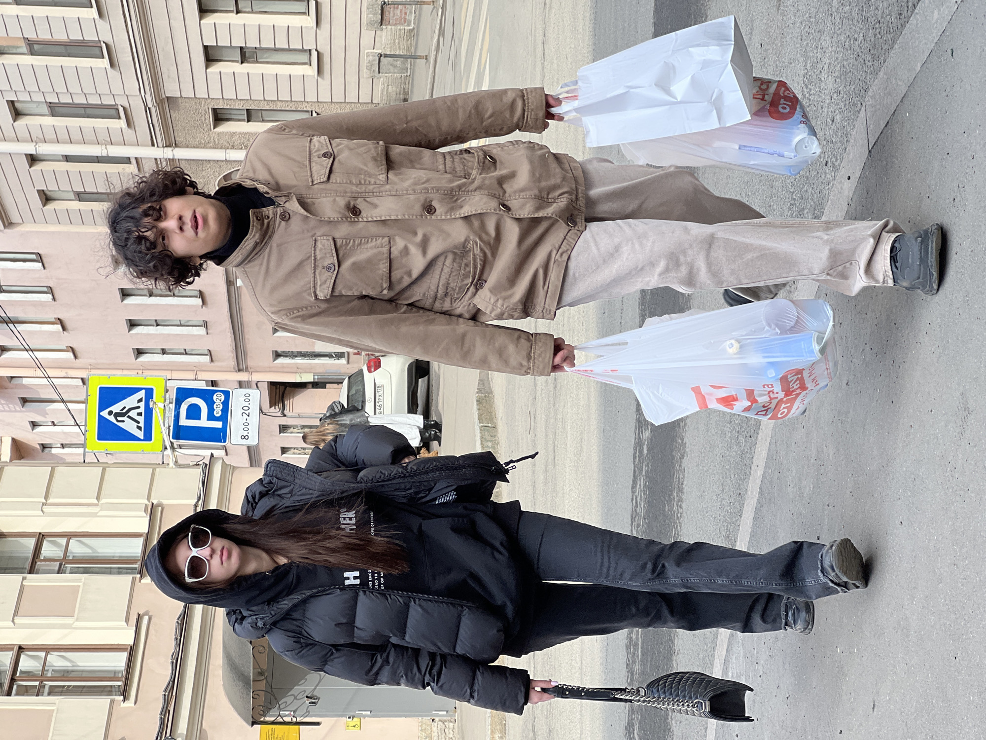 Pedestrians and dog walker captured on Saint Petersburg streets