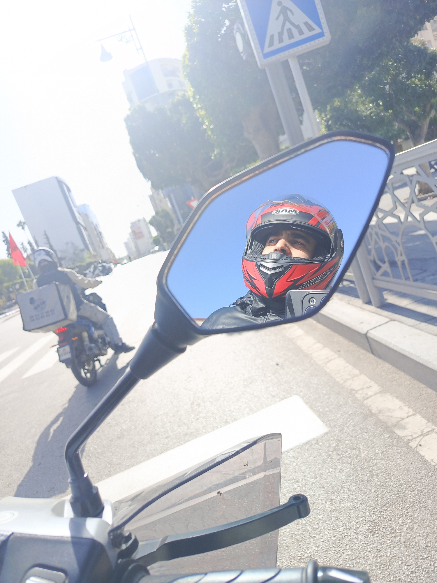Motorcyclist captures street scenes and public square in Meknes