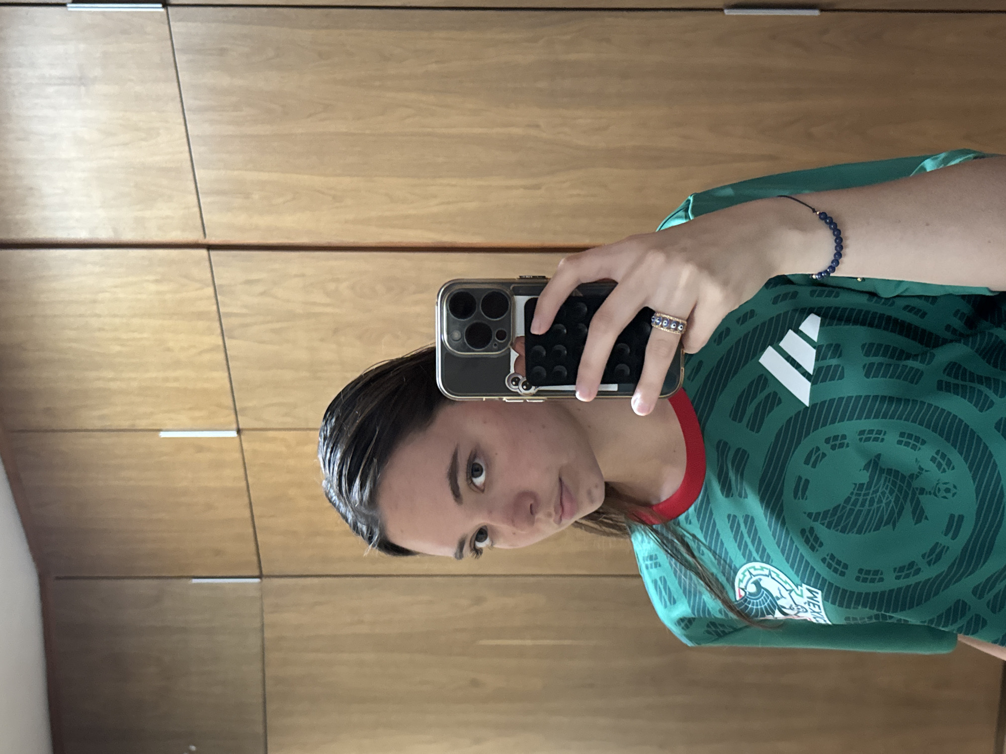 Person Takes Selfies in Mexico Soccer Jersey