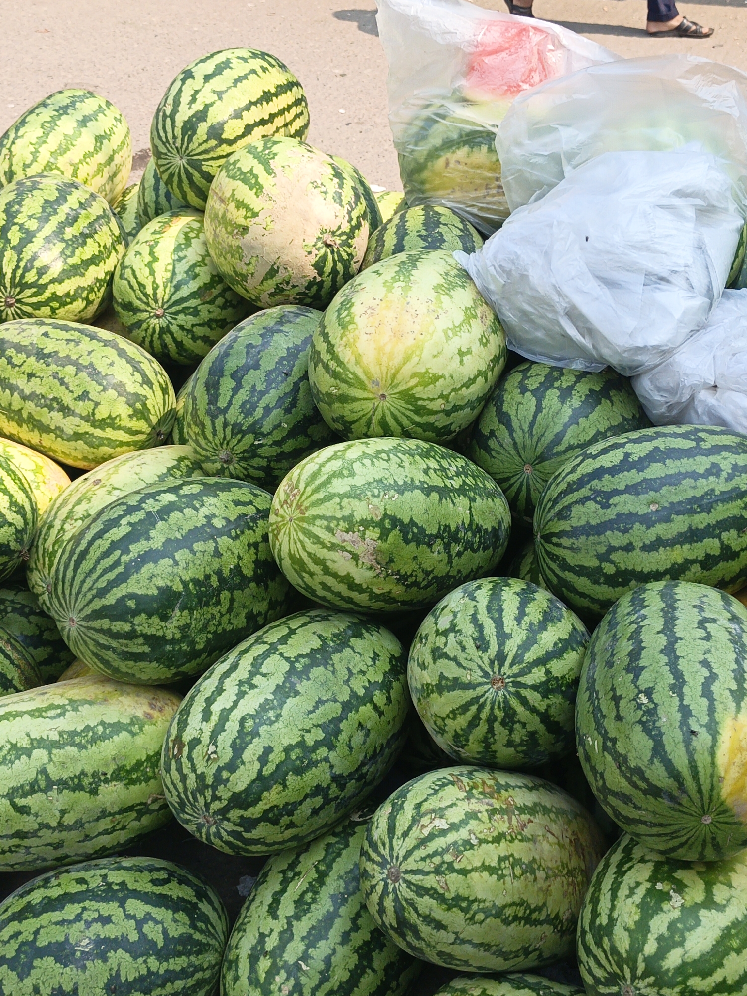 Street watermelon vendor operates in Muladi, Bangladesh