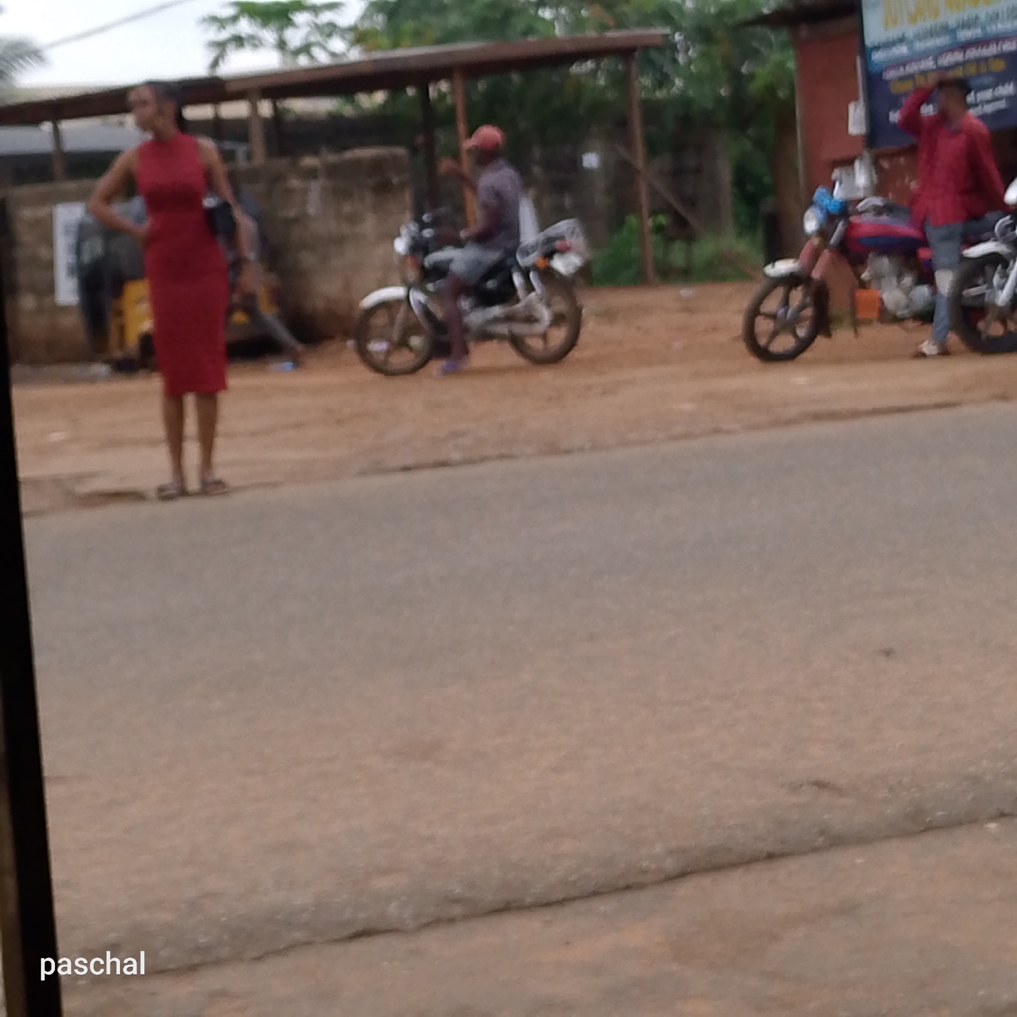 Morning tailoring work captured in Nigerian commercial district