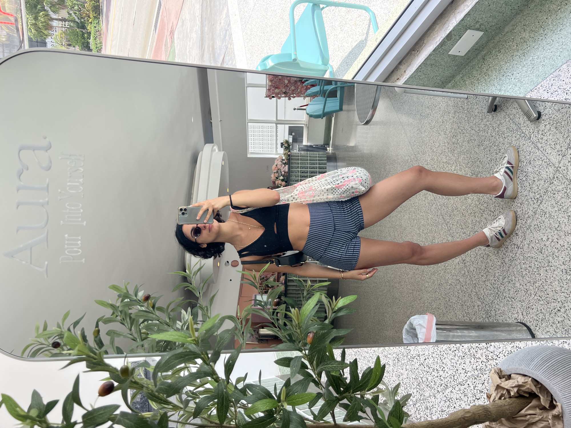 Woman takes selfie in modern Miami Beach interior