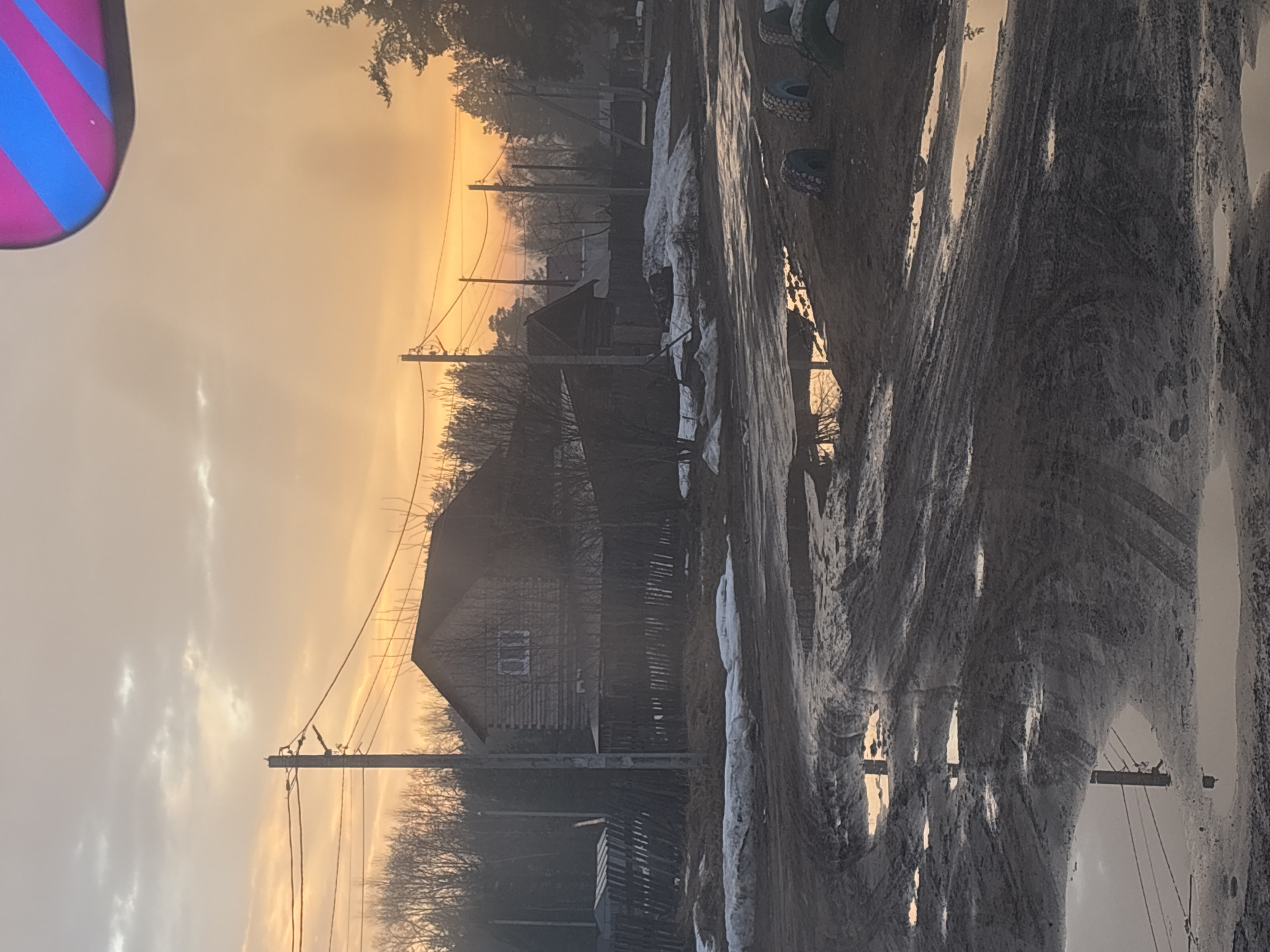 Rural street scenes documented in Rusalevka, Russia during golden hour
