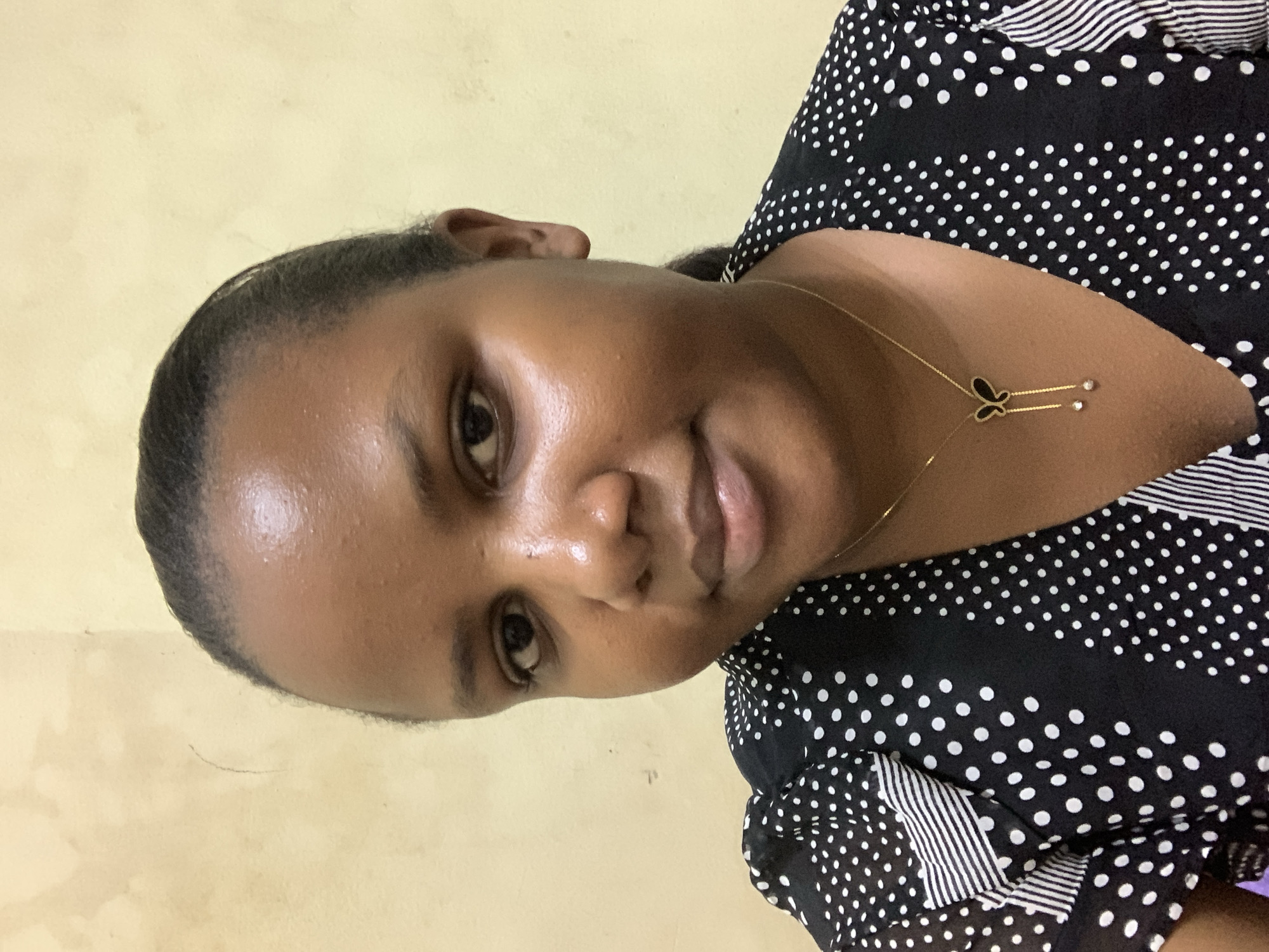 Woman takes selfies in bedroom in Dar es Salaam