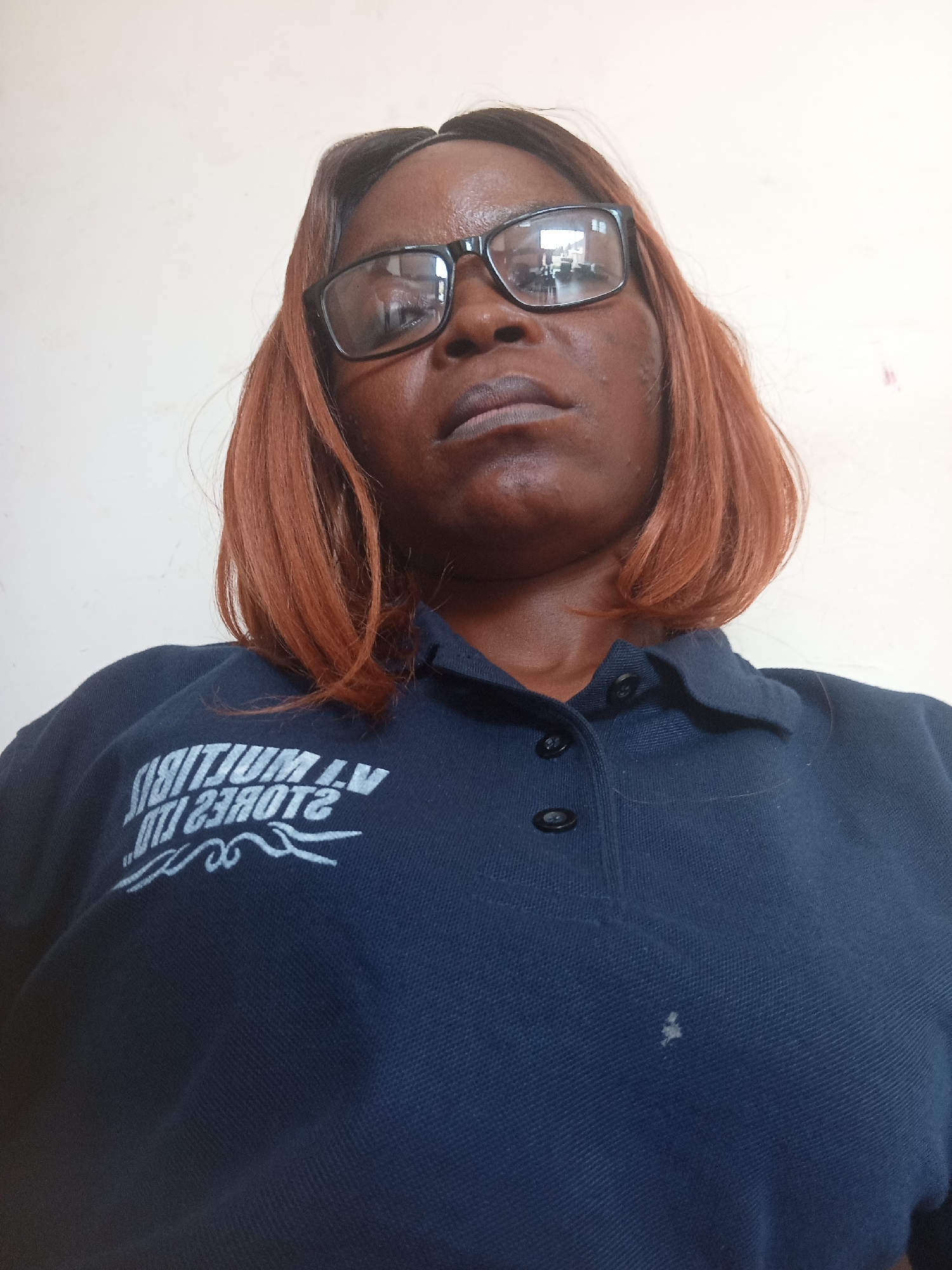 Multiple selfies in a Jubilee Stores Ltd polo shirt, indoors
