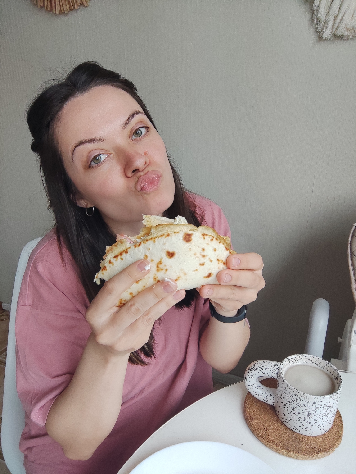 Woman's morning routine: skincare, cooking, eating breakfast wrap