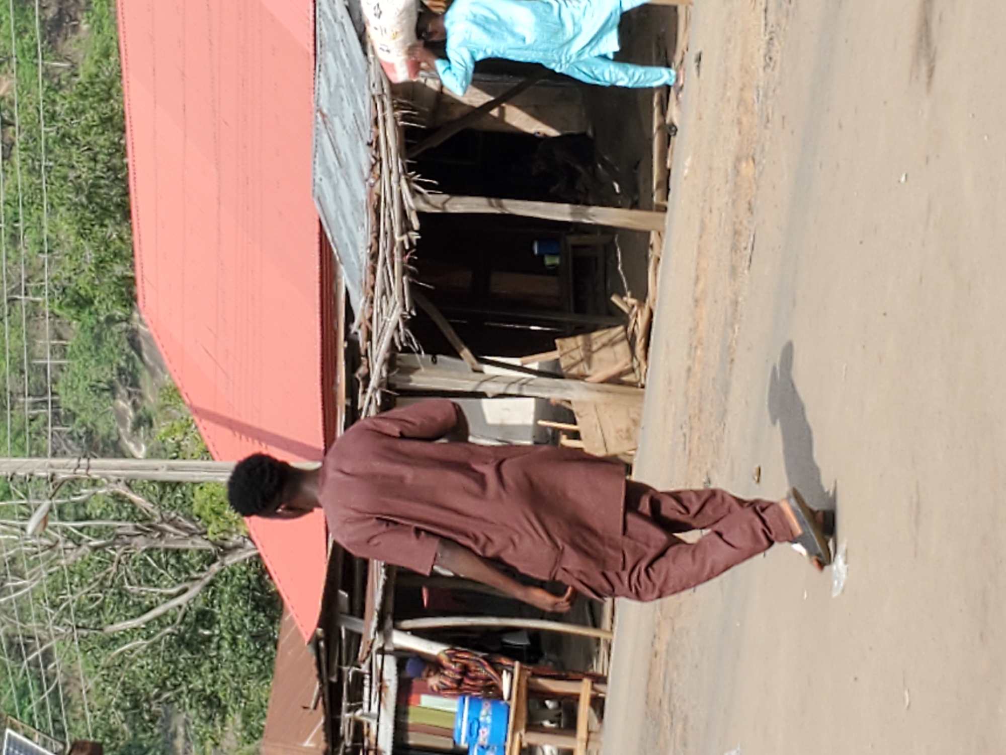 Person in traditional dress photographed outdoors in Mararaba, Nigeria
