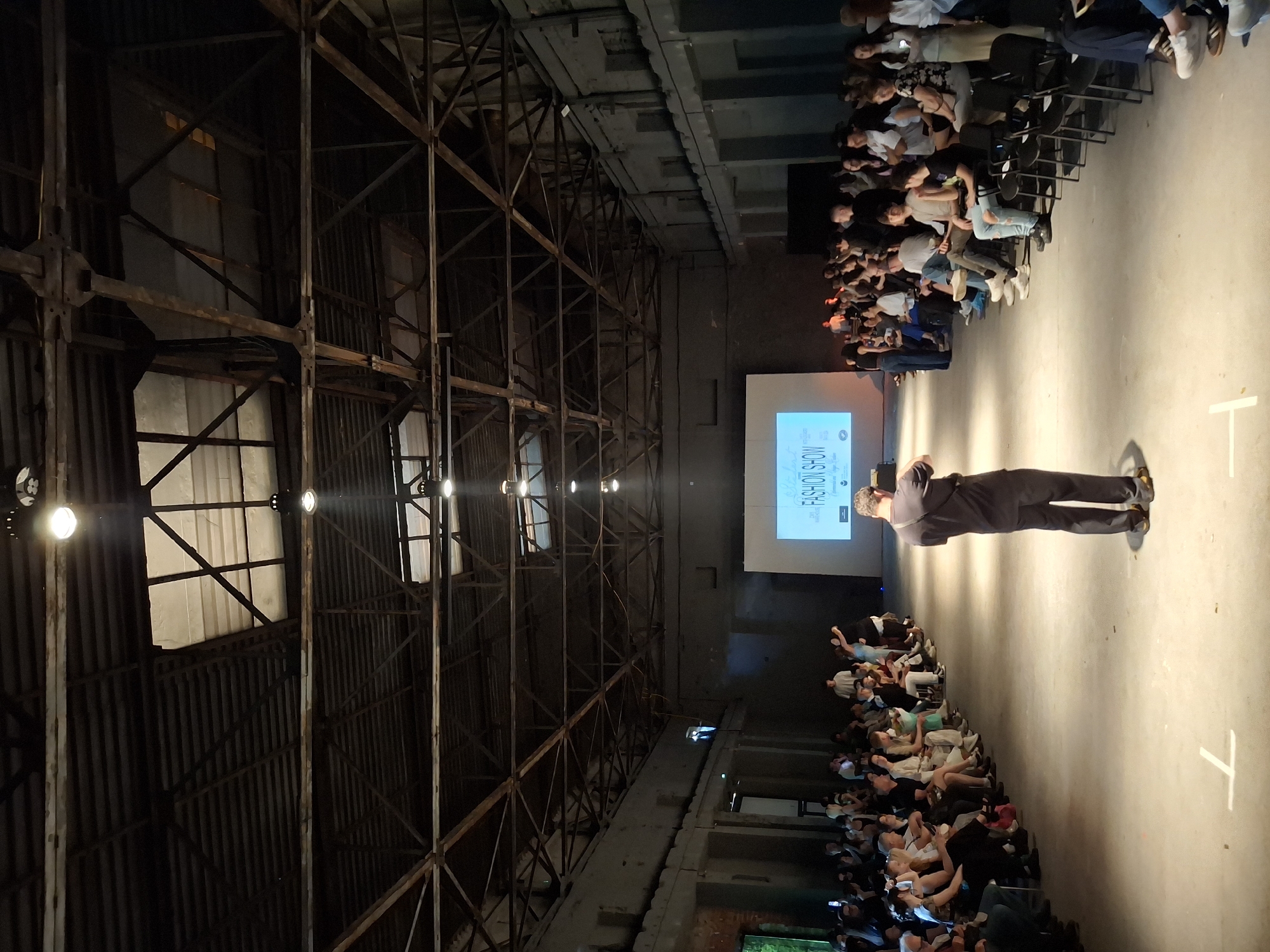 Fashion show held in industrial warehouse space draws crowds