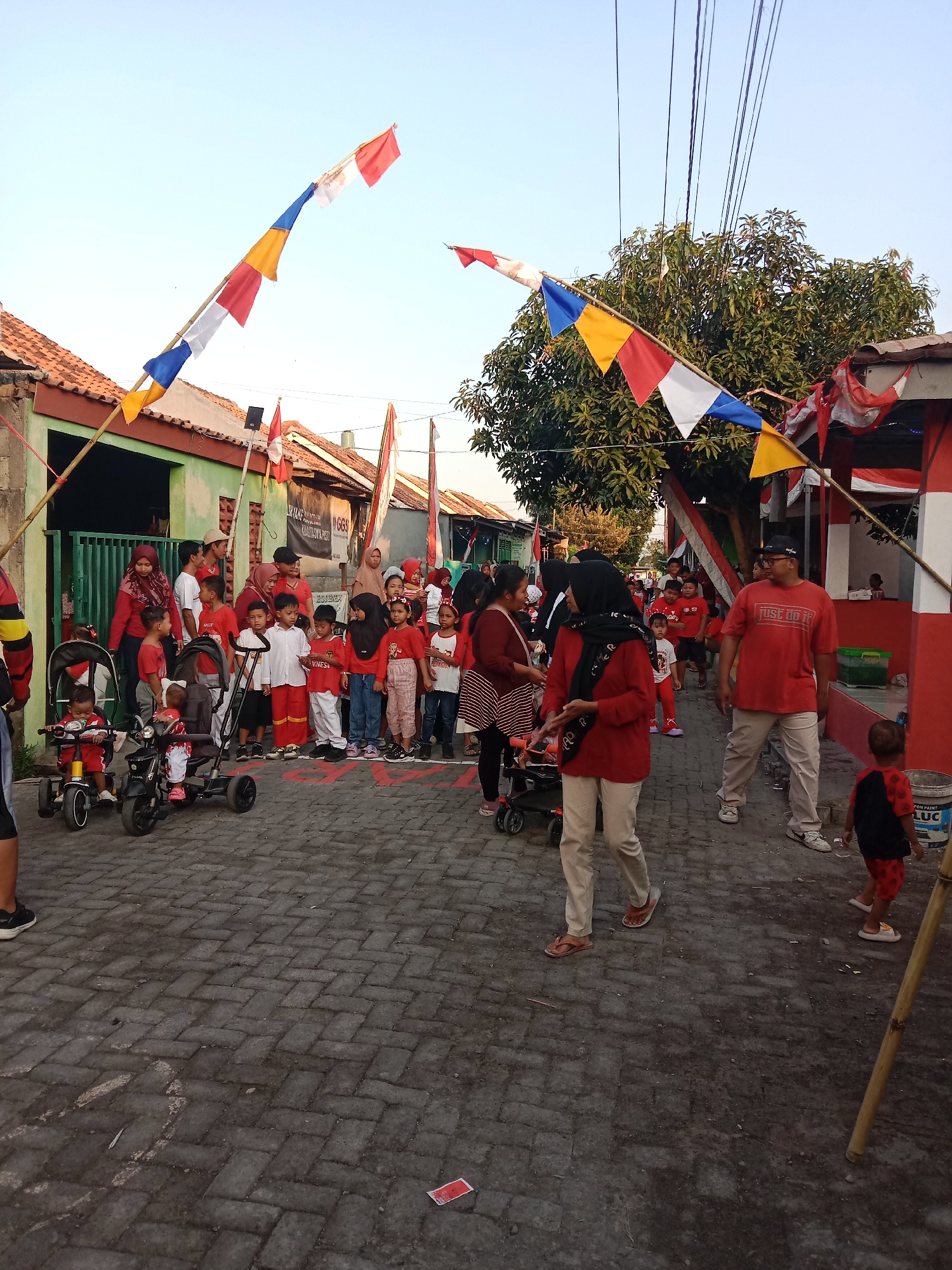 Red-and-white street celebration winds through Brangsong, Indonesia