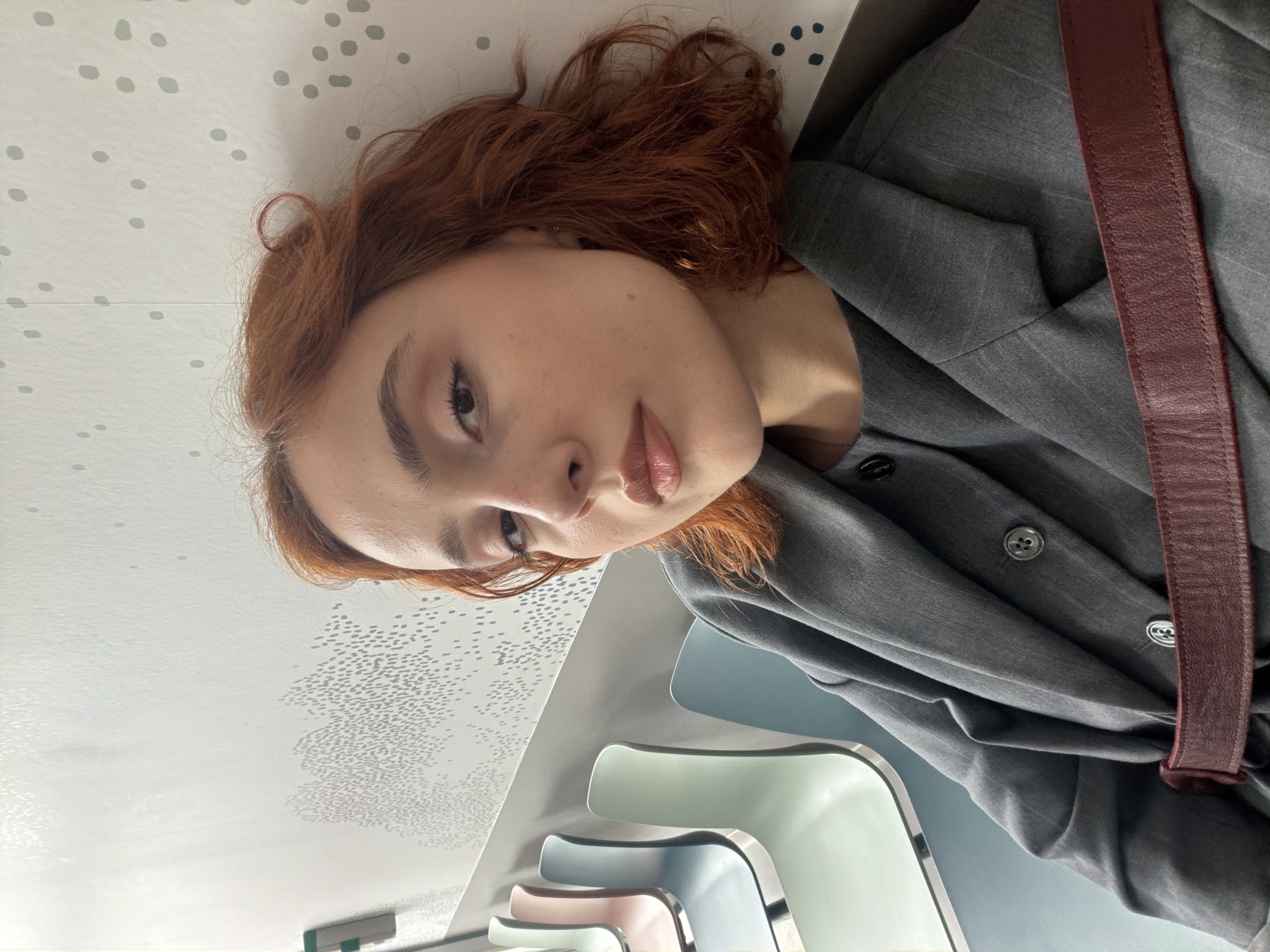 Woman photographed in Strasbourg medical building waiting area