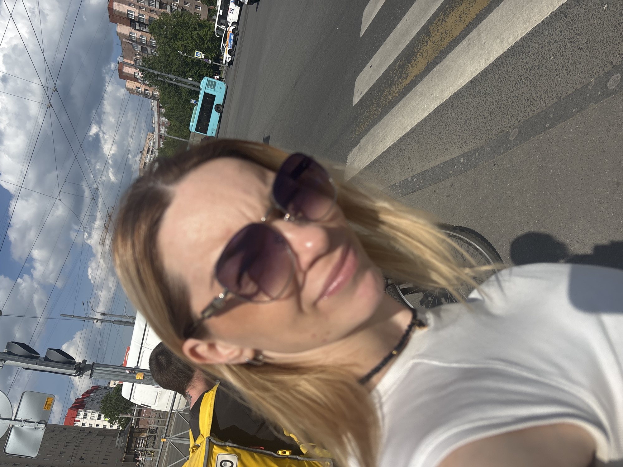 Woman documents afternoon street life and meal in Saint Petersburg