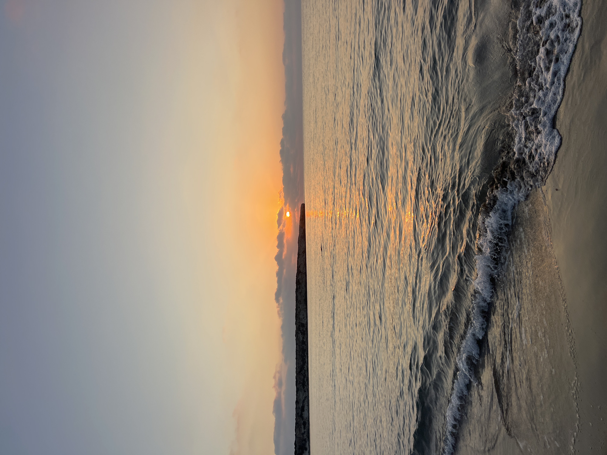 Sunset and calm waves along the Cyprus coastline near Ineia