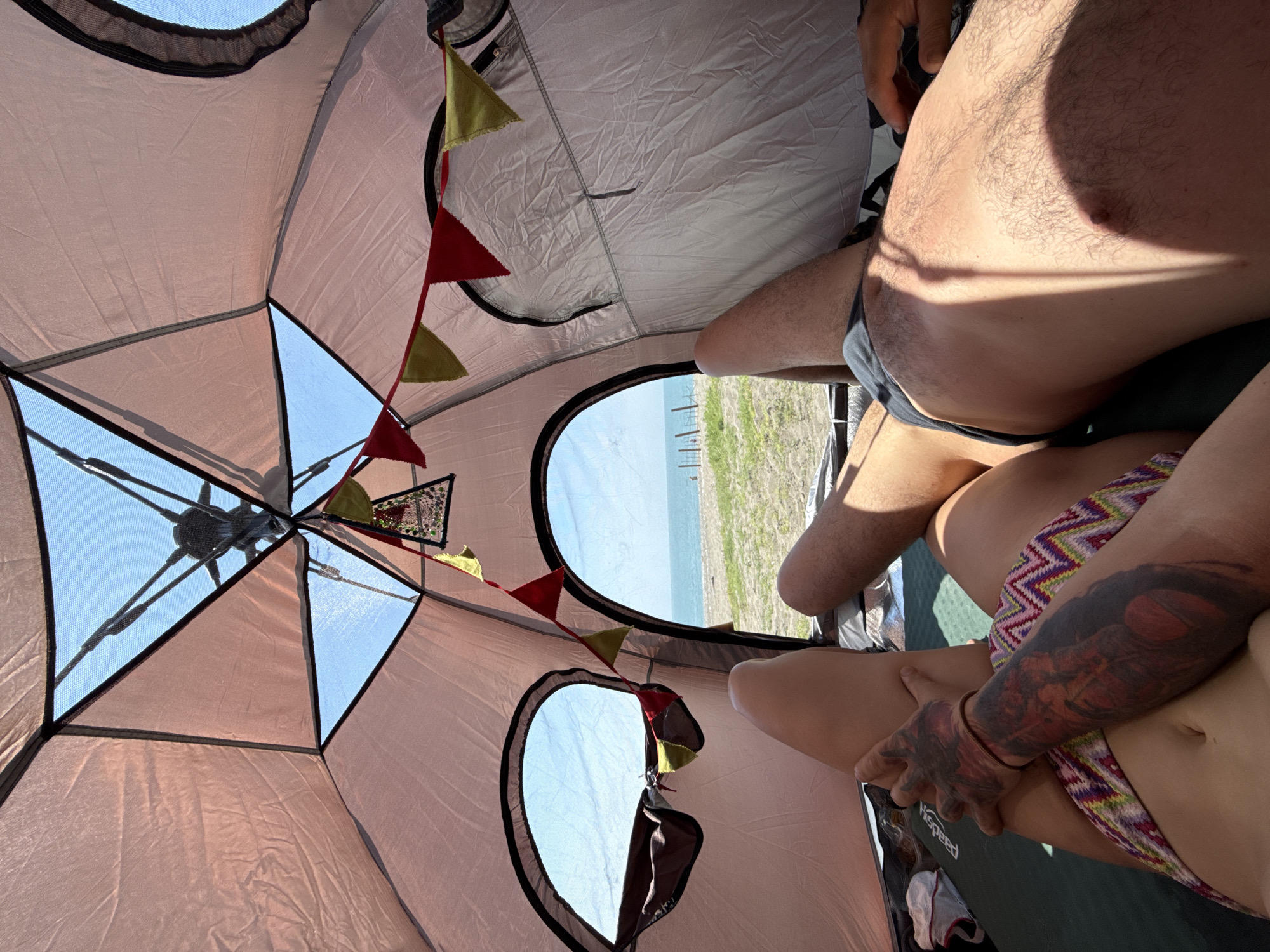 Lazy beach day: tent views and a smiling seaside selfie