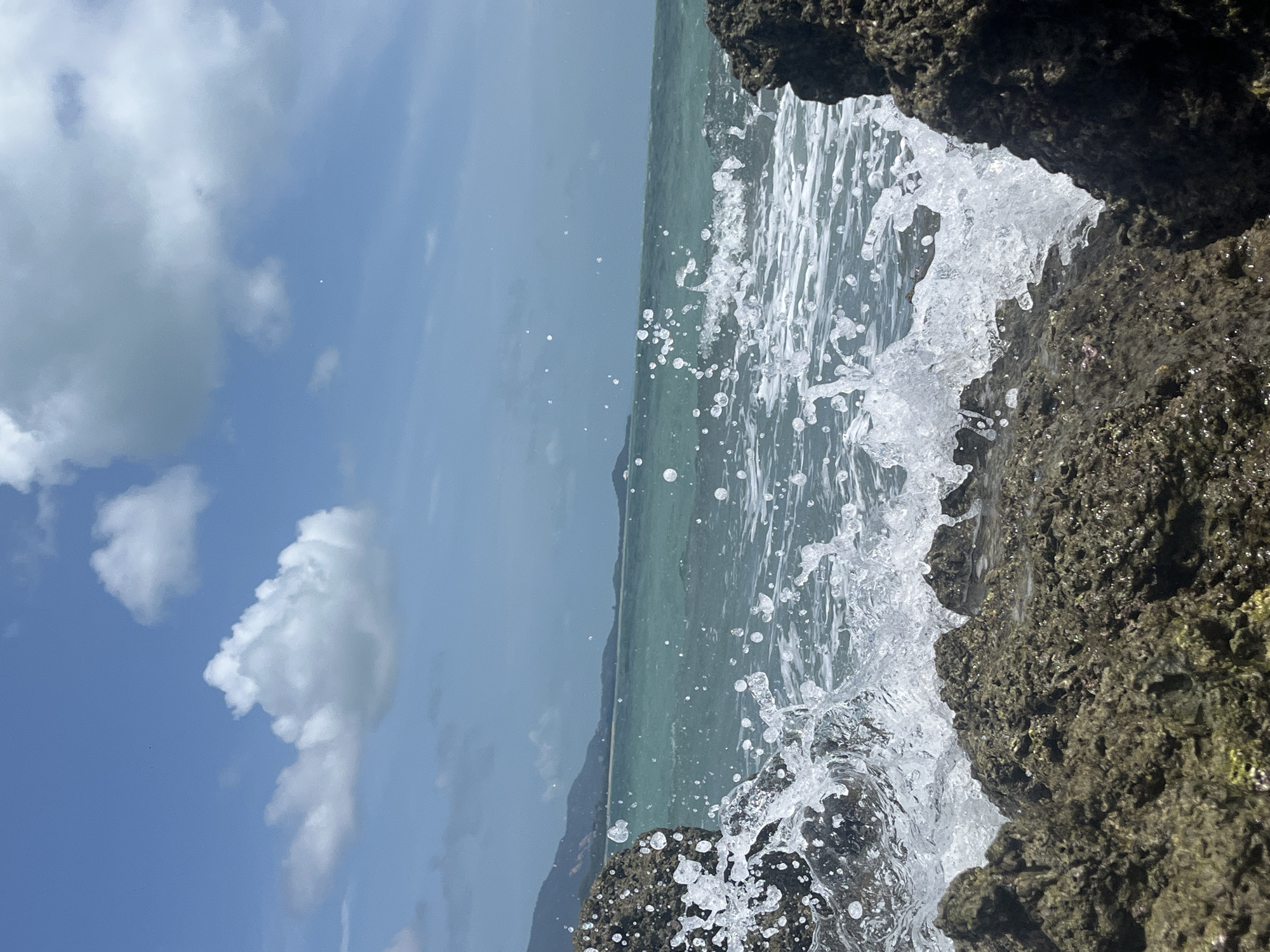 Ko Samui's rocky shoreline at low tide, July morning